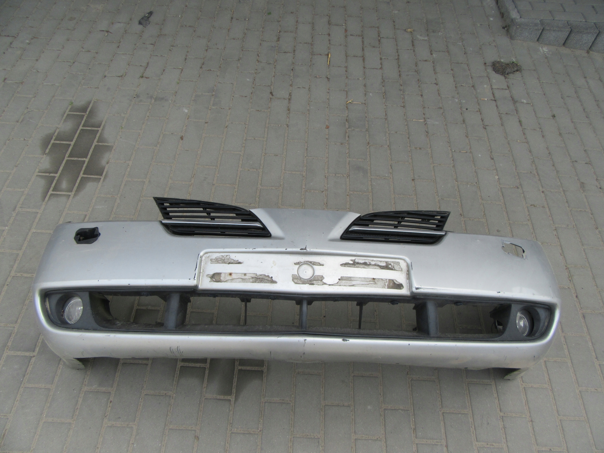 Nissan Primera P12 zderzak przedni przód pod spryski