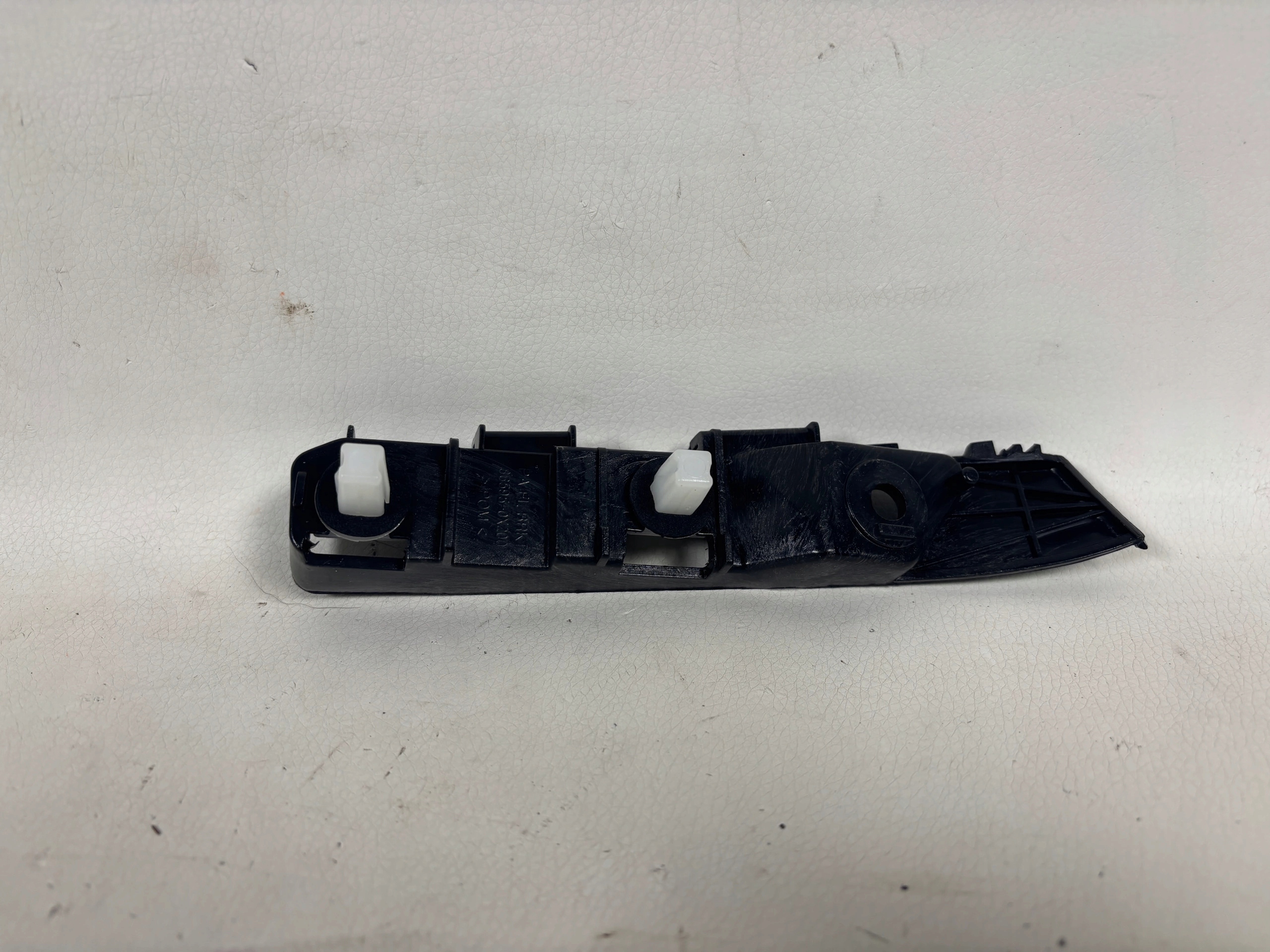 Hyundai i10 bumper bracket left 86595-0X200