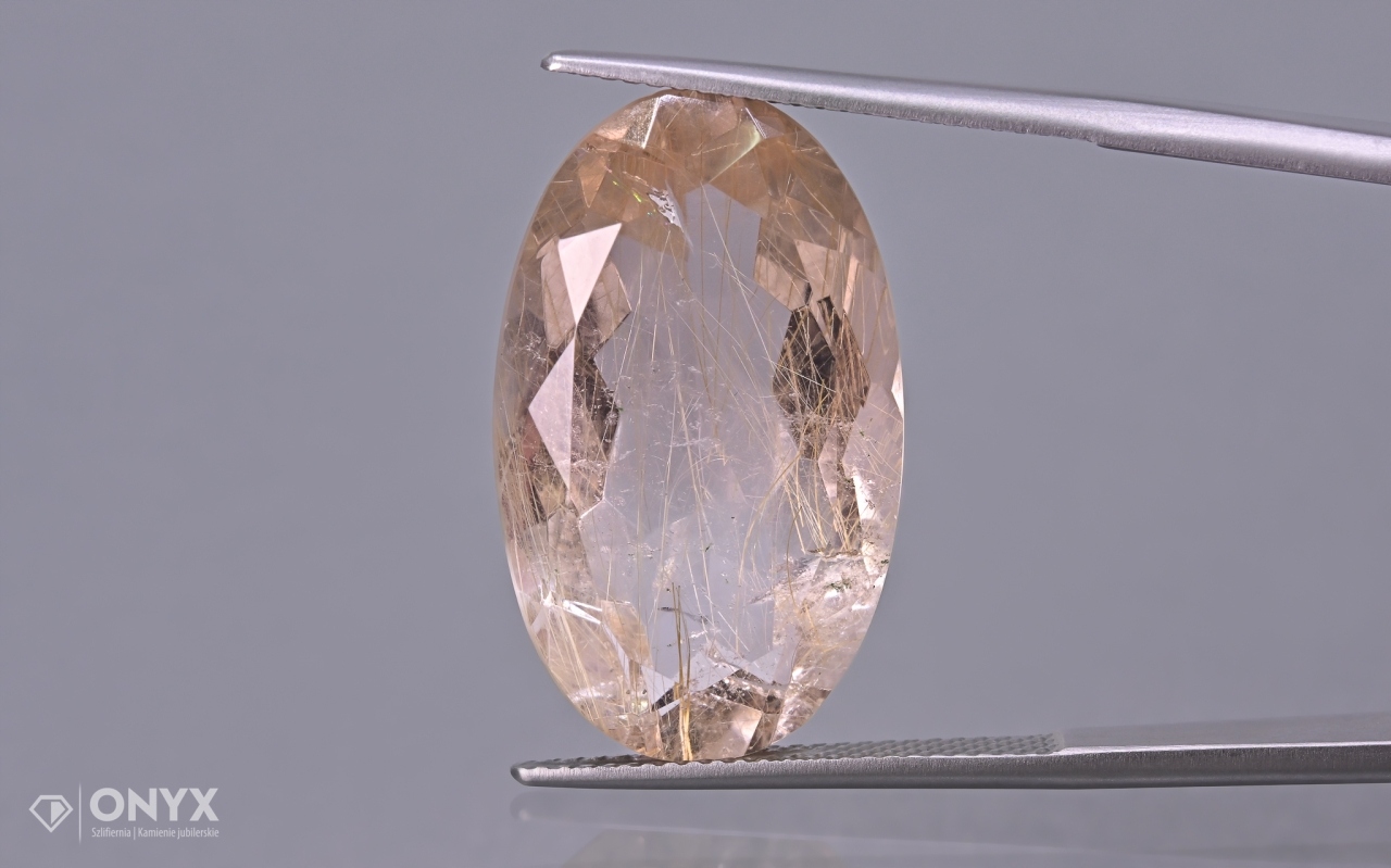 Křemen s rutilem fazetovaný ovál 25x15 mm