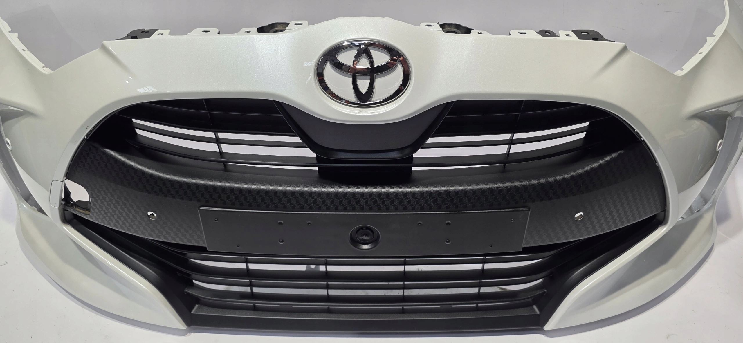front bumper grille TOYOTA YARIS IV 20- PDC original 52119-0DA00