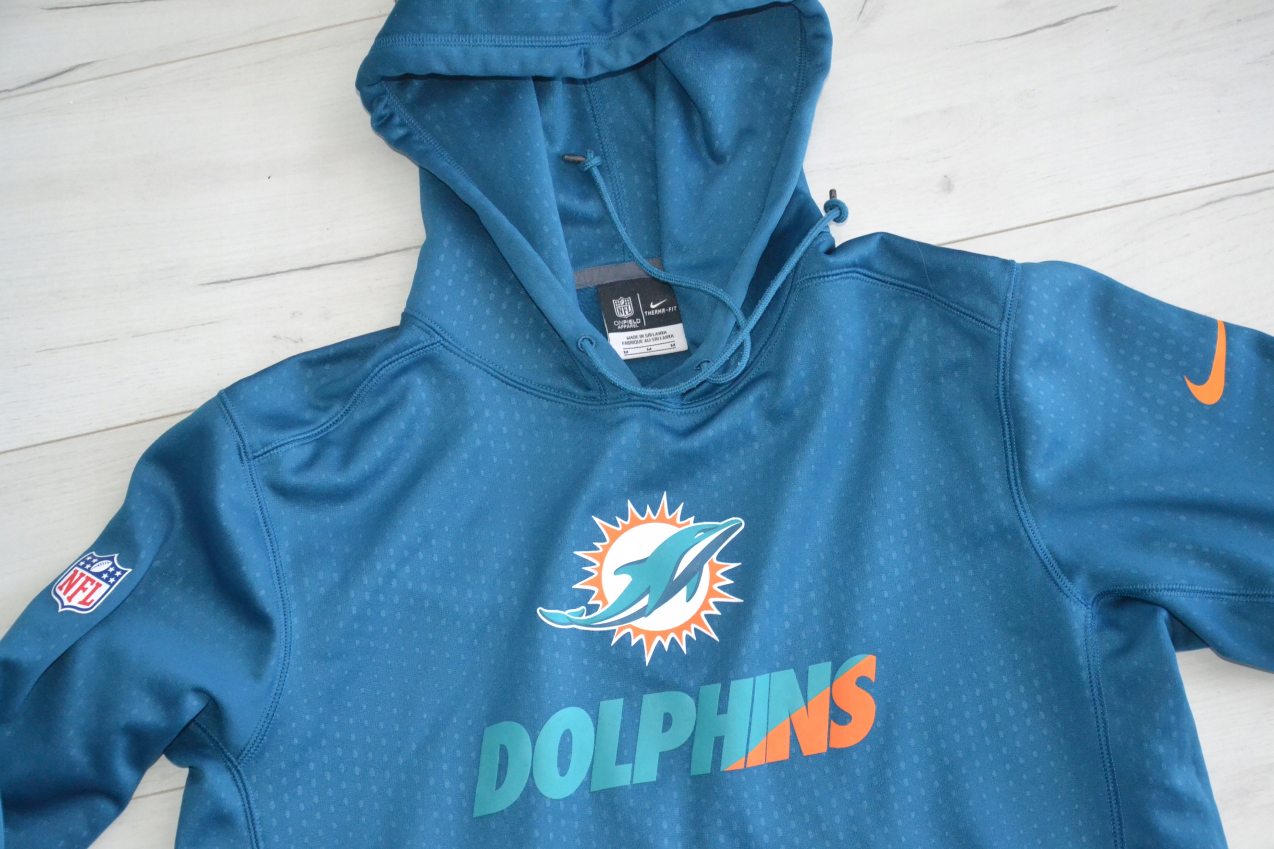 NFL NIKE DOLPHINS THERMA-FIT BLUZA Z KAPTUREM M Kod producenta 2240