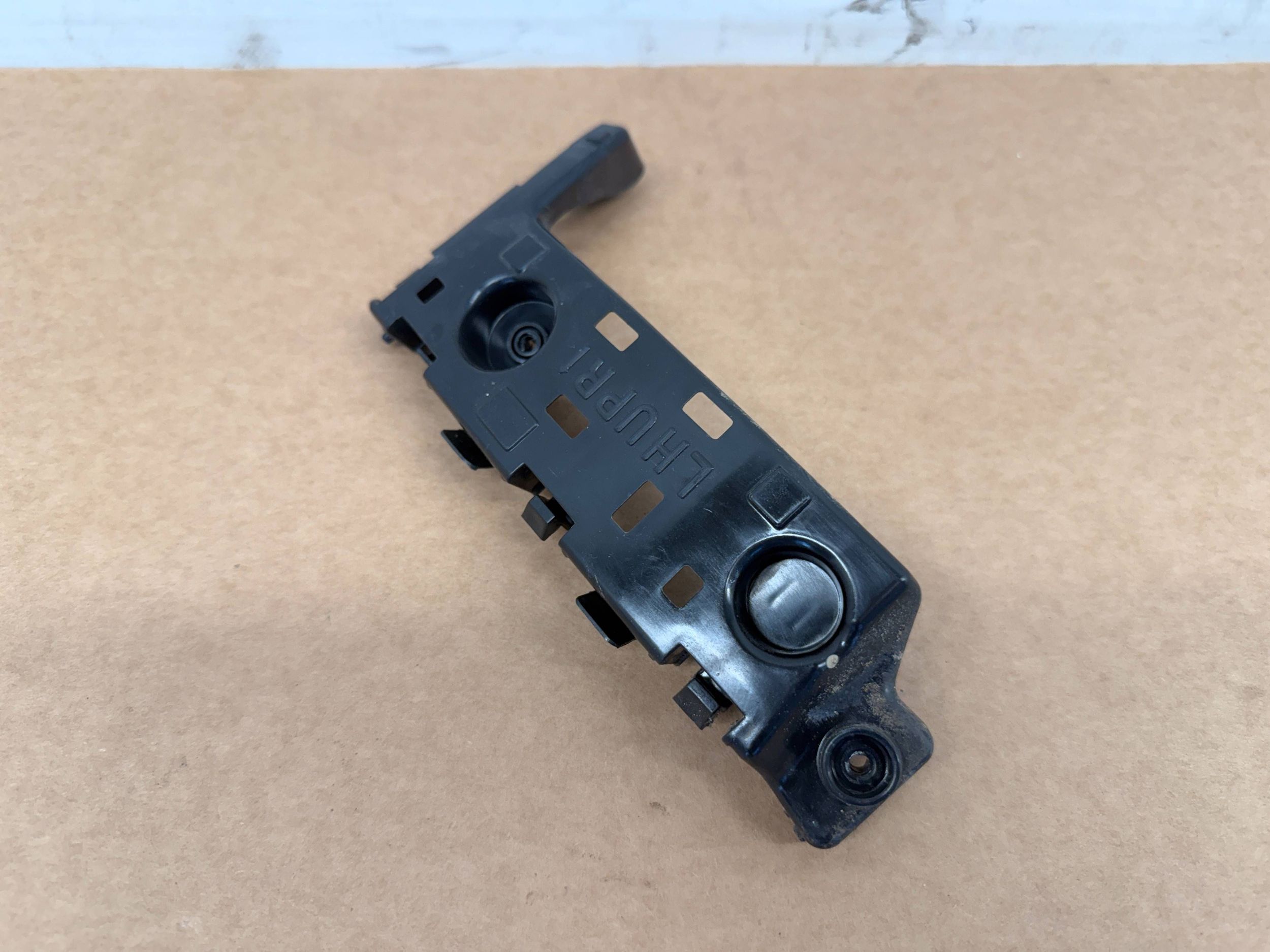 Dacia Spring bumper bracket left rear part 850458102R