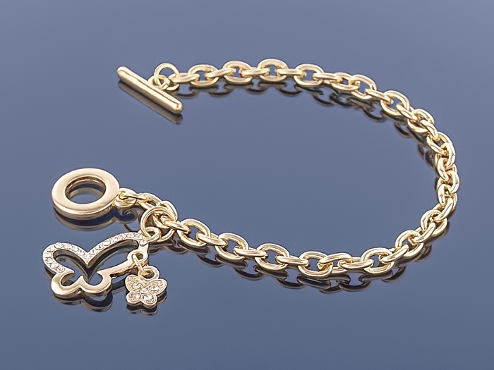 

Złota bransoletka Charms