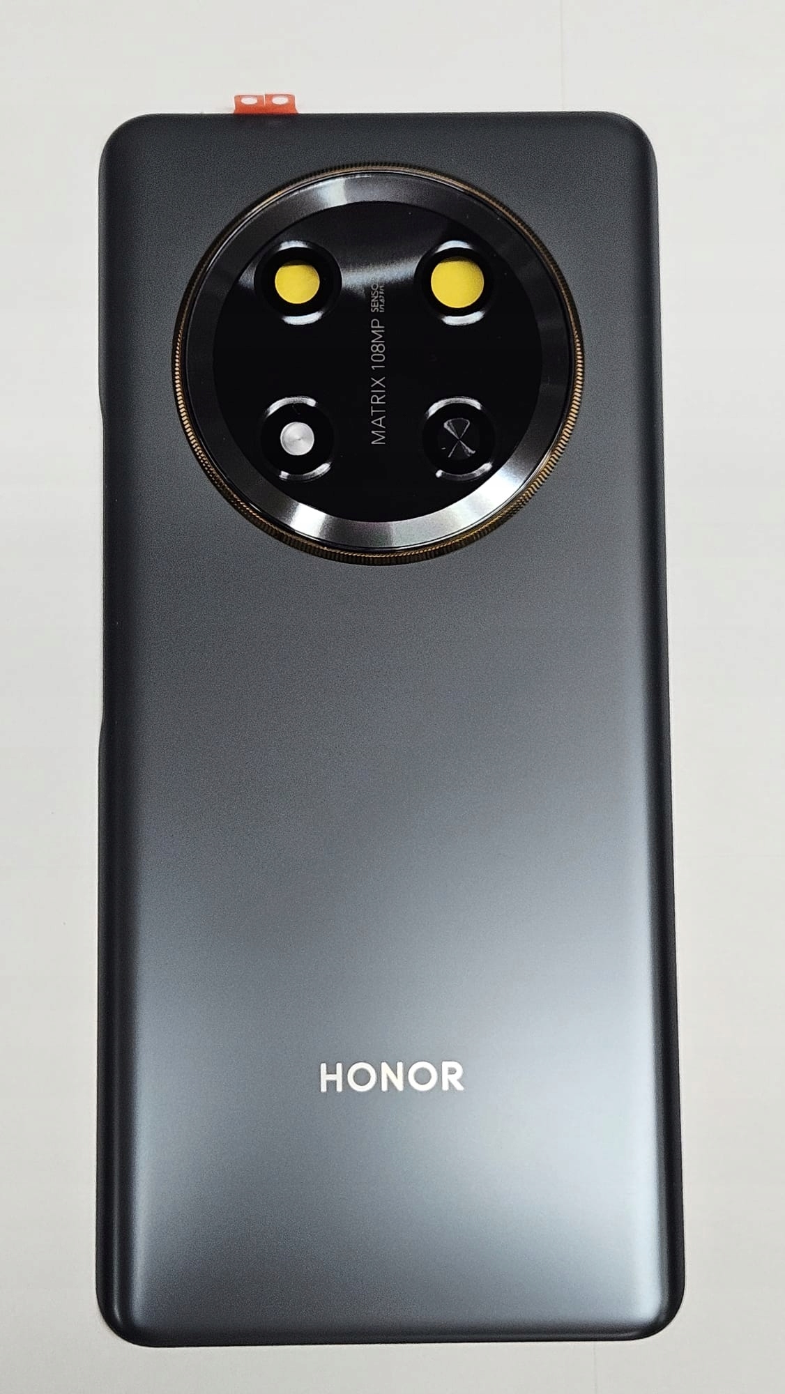 Klapka baterii , tył Honor Magic 7 Lite czarny z szybką kamery i taśmą mont