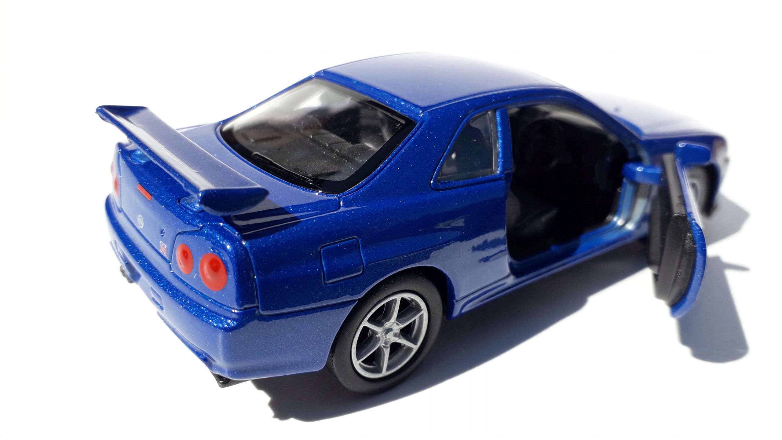 Nissan Skyline GT-R(R34) Niebieski Metalowy Model WELLY 1:34 Model NISSAN SKYLINE