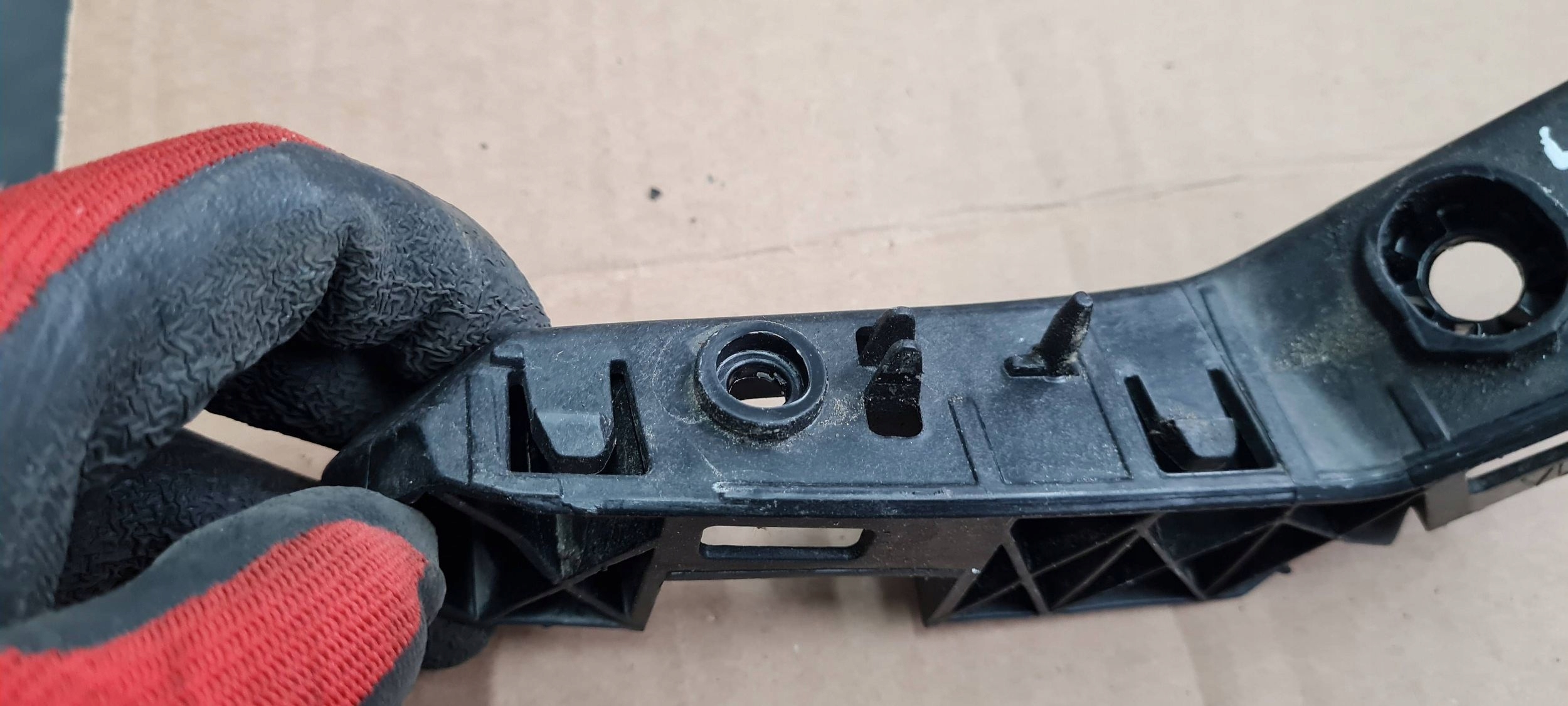 Q3 83A support bracket holder of a bumper left front 83A807183