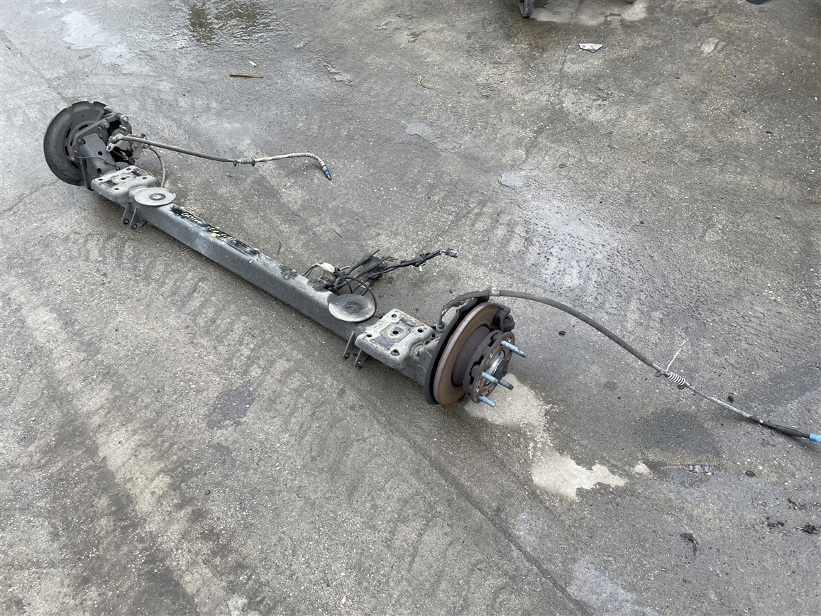 BELKA OŚ ZAWIESZENIA TYŁ PIASTA ZACISK 2.0 FORD CUSTOM LIFT 19-23R 2020R