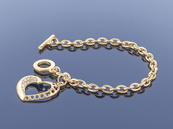 

Złota bransoletka Charms