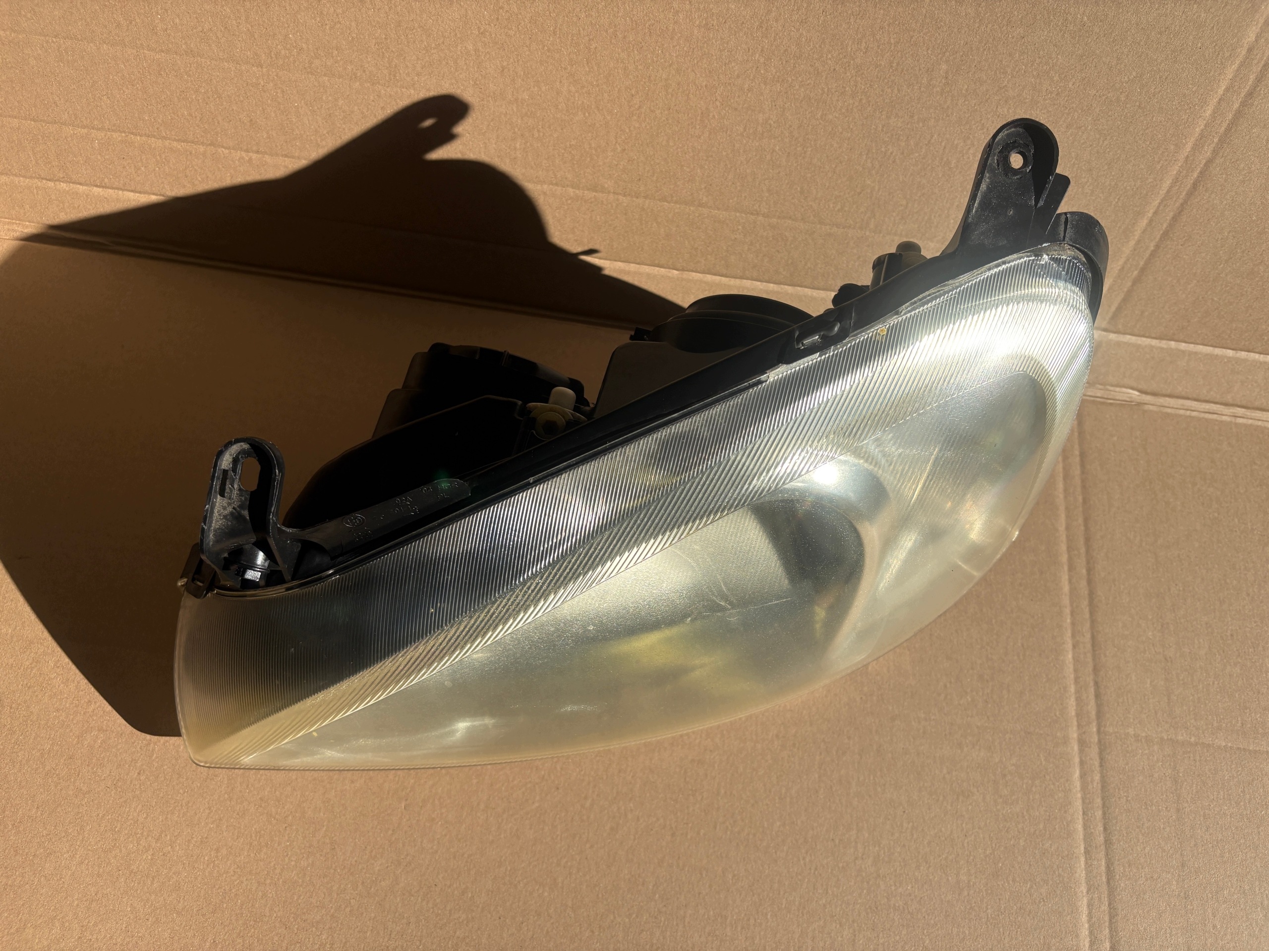 OPEL CORSA C feu gauche avant 09114330 89302111