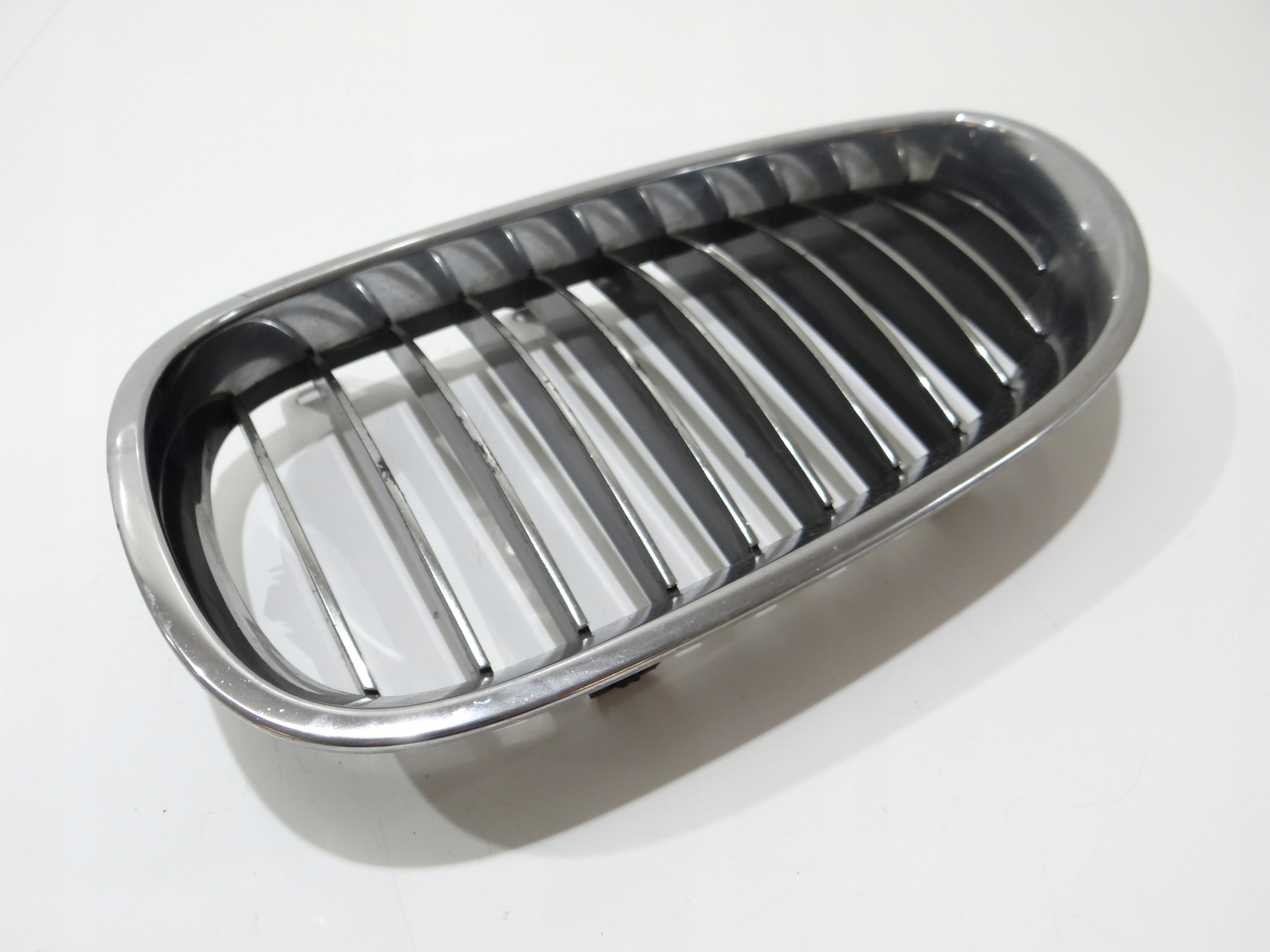 hűtőrács hip pack eleje bal BMW E60 E61 7065701 (4273211)