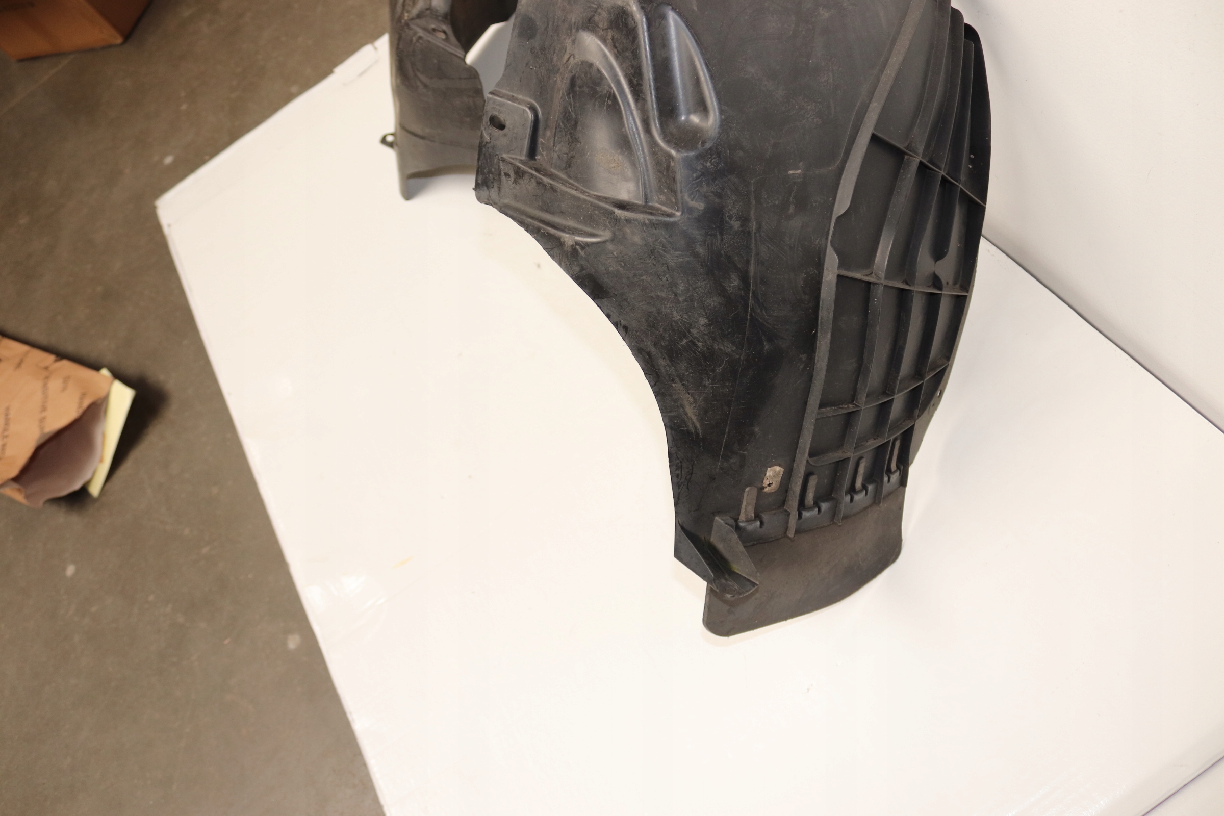 OPEL ADAM mudguard front left UZYWANE ORYGINALNE GM 39005657