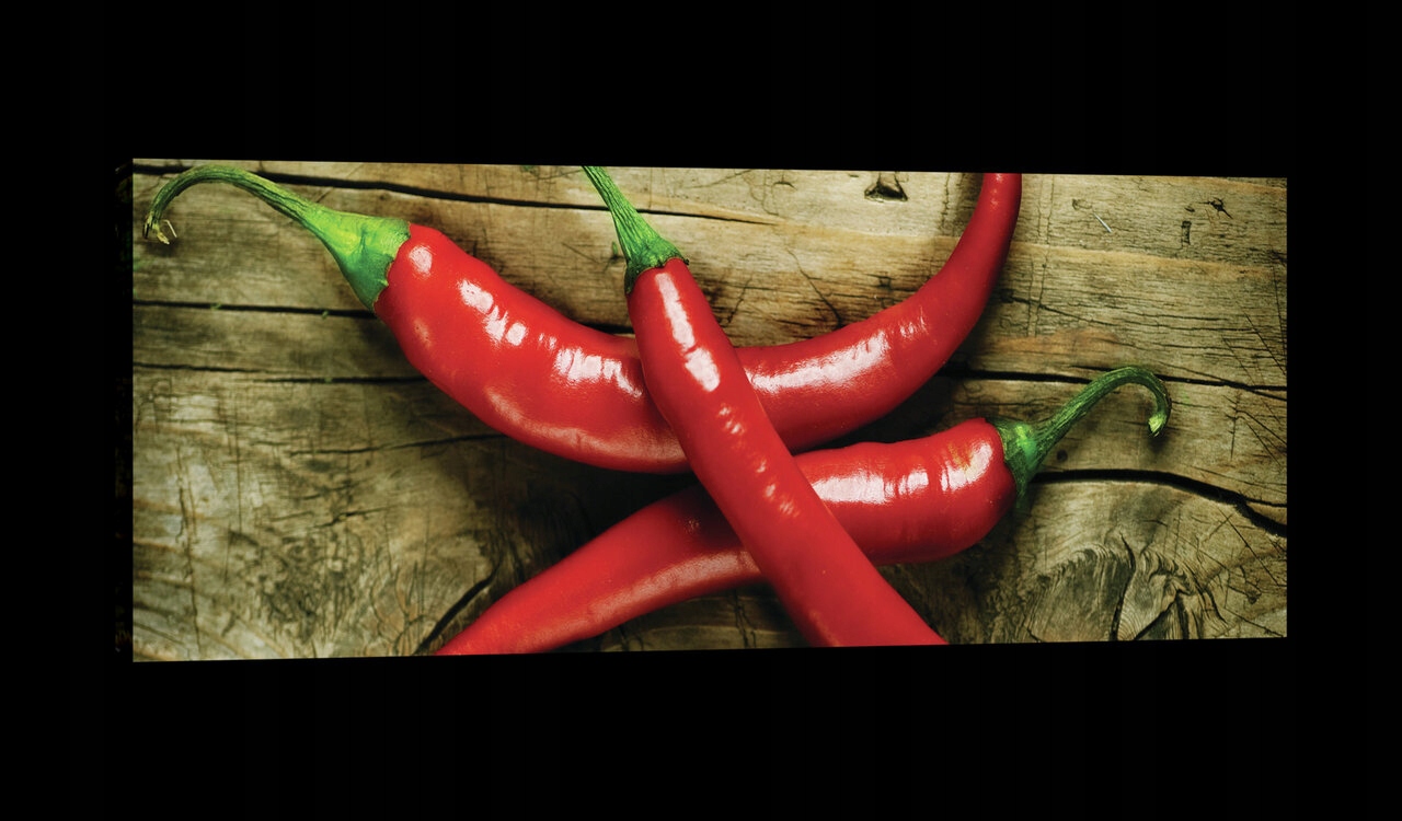Obraz 145x45 Červená chilli paprička ostrost chuť energie textura