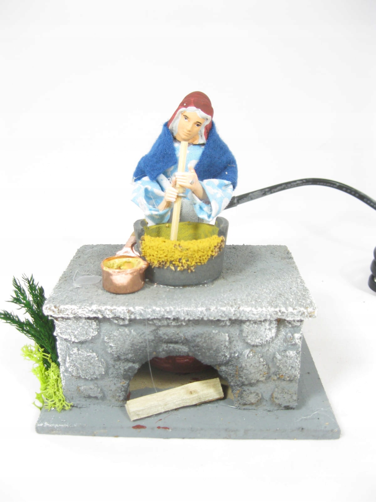 

Ruchoma Figura Do Szopki- Kobieta przy garnku