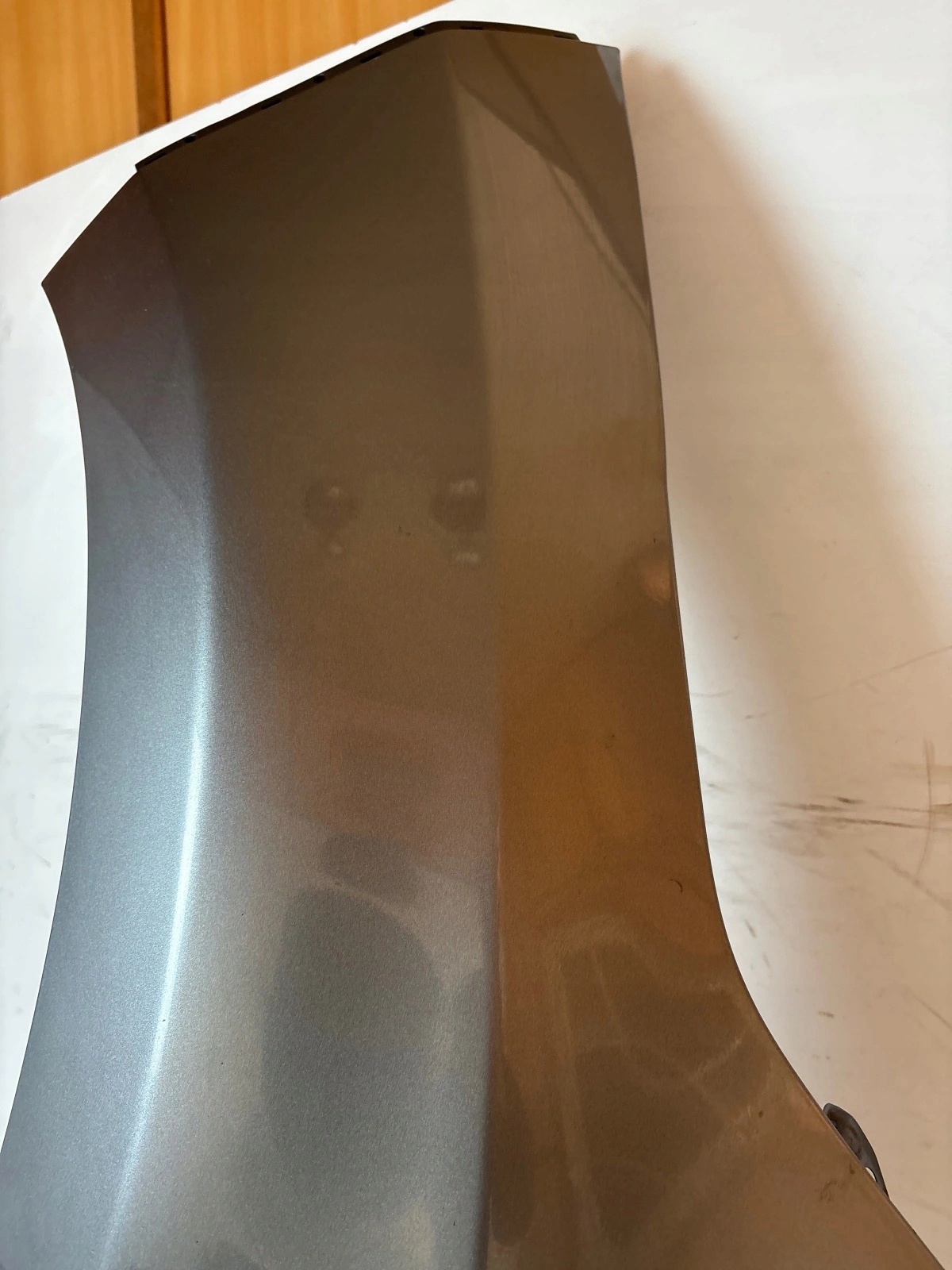 fender front front left Nissan Leaf and grey