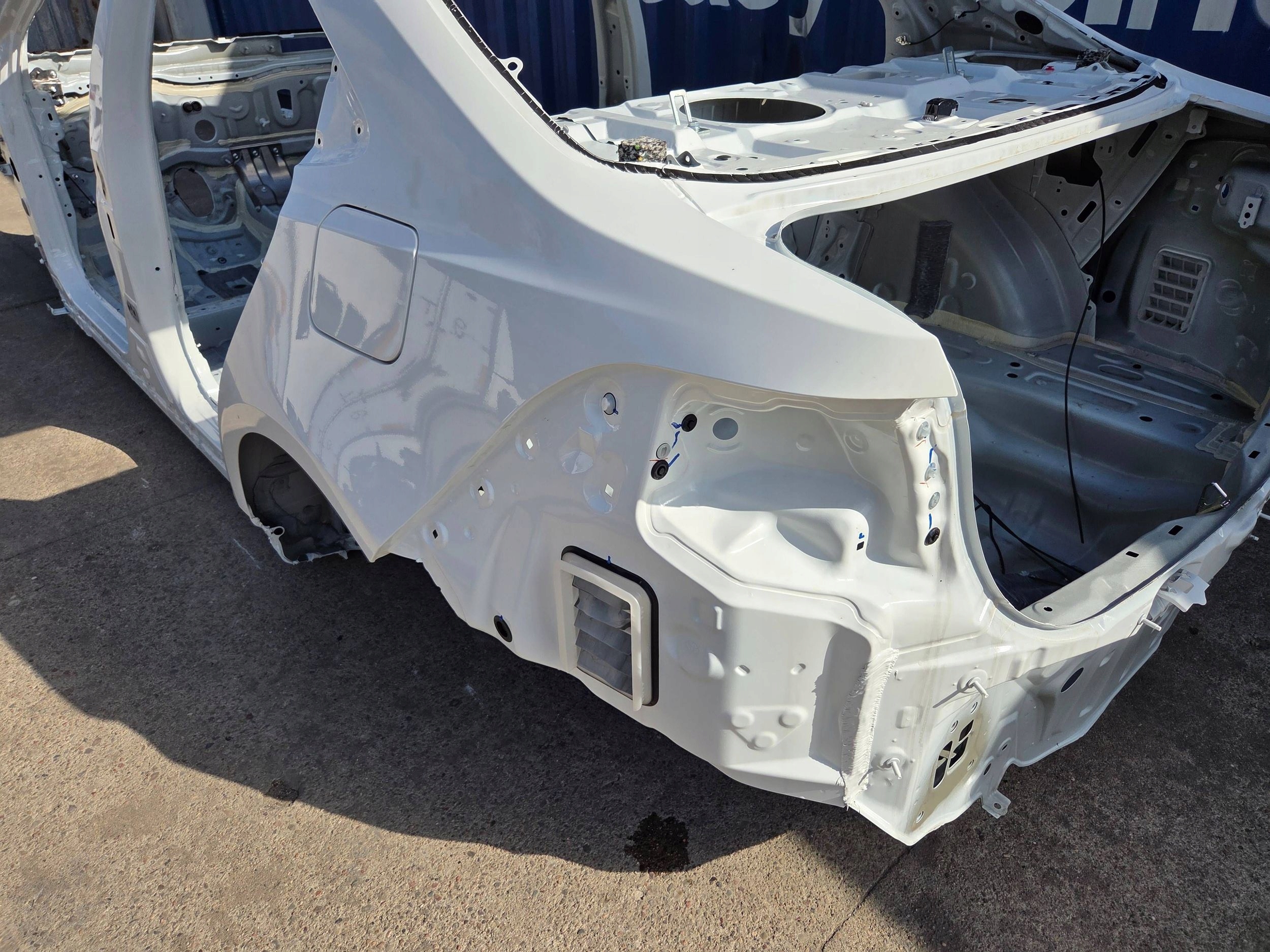 Toyota Corolla E21 sedan 2026r quarter rear left