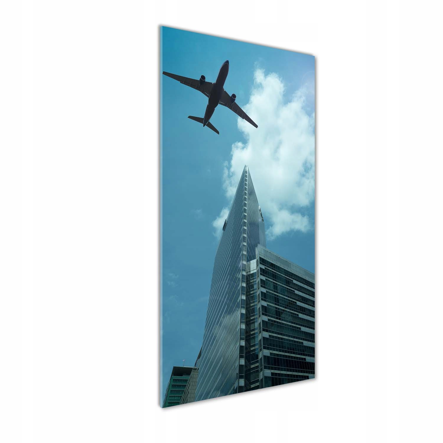

Foto obraz akrylowy Samolot nad miastem 50x125cm