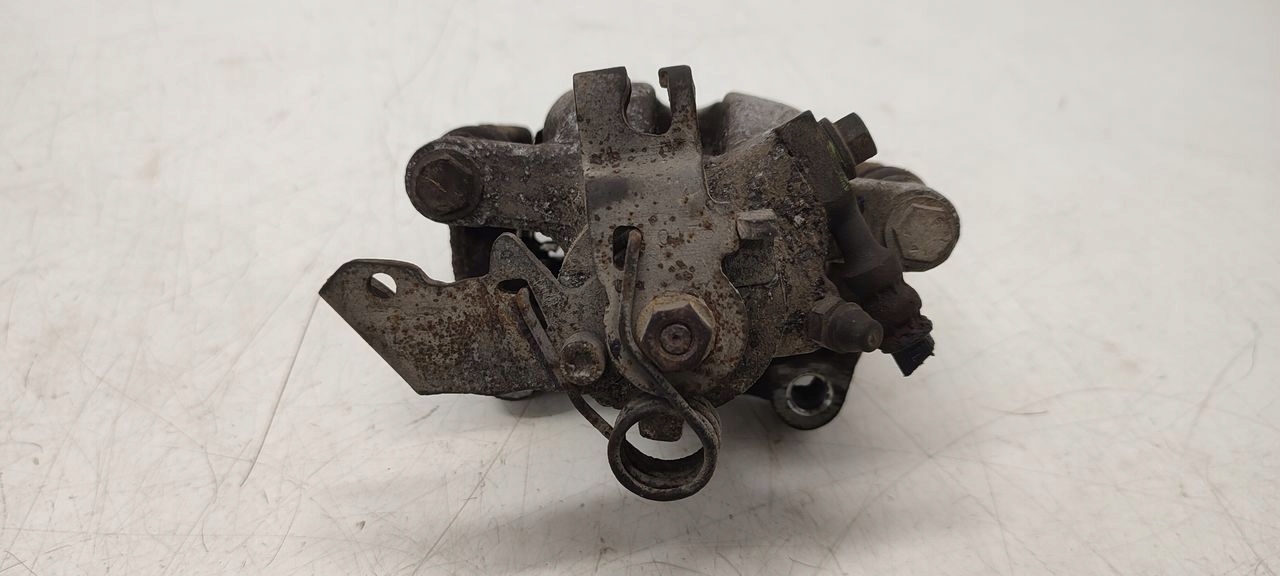 caliper rear part rear left Opel Astra H 1,6 HB