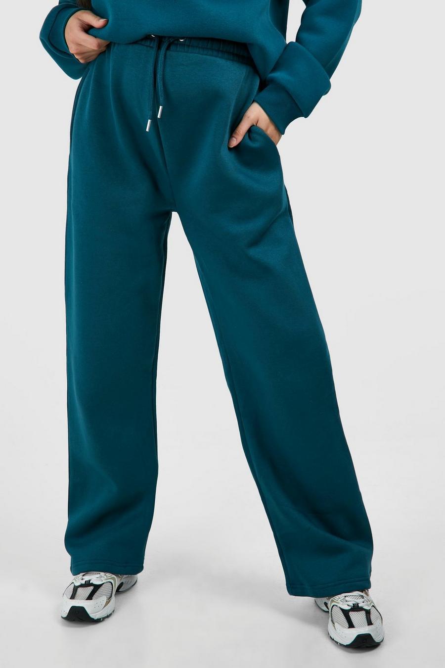 CIĄŻOWE SPODNIE DRESOWE CIEMNO TURKUSOWE GUMKA W PASIE KIESZENIE BOOHOO 38 Rozmiar 38