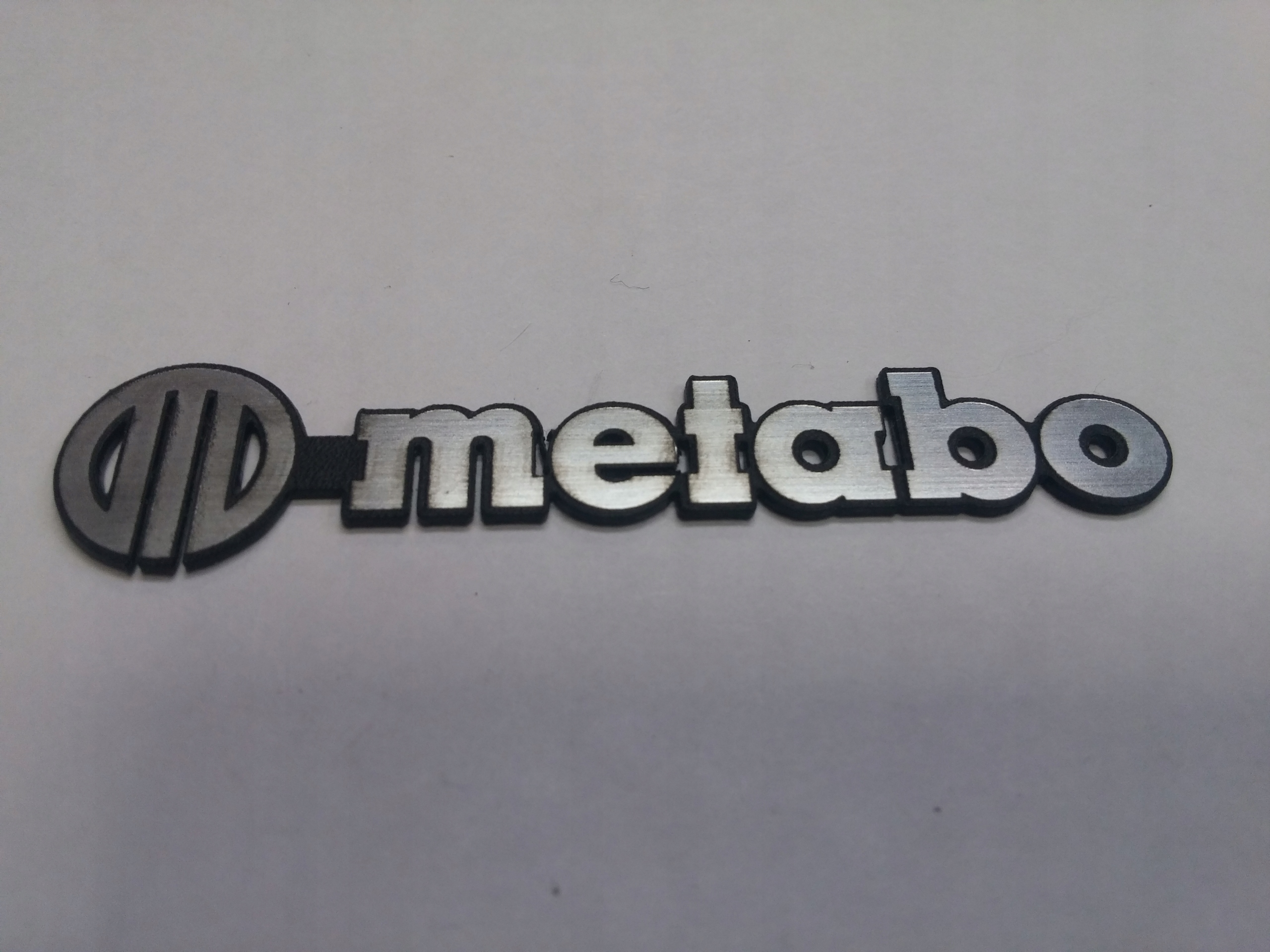 

Metabo naklejka emblemat 65 x 14 mm * Srebrna