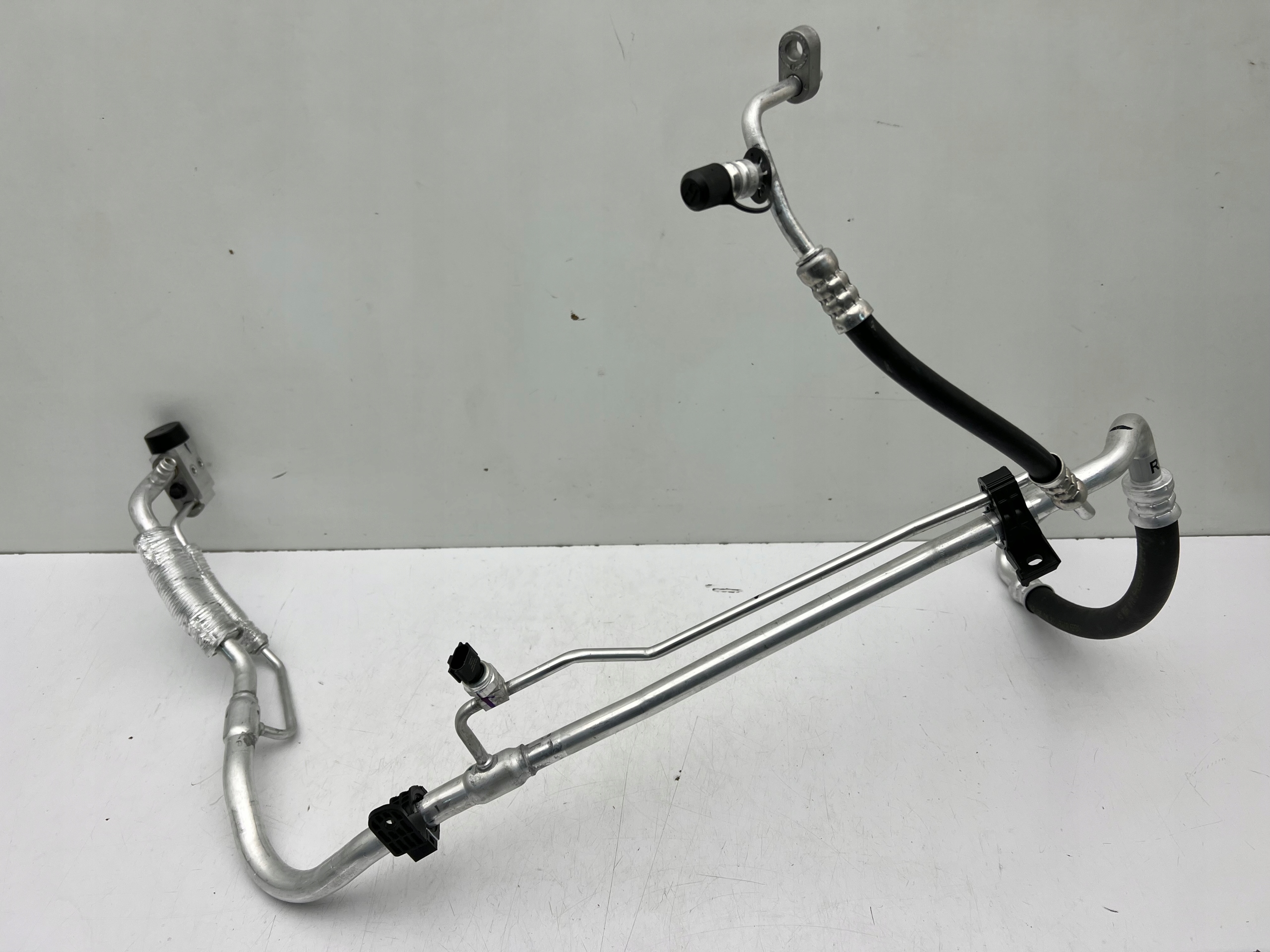 97775-CZ001 - SPORTAGE V TUCSON IV КАБЕЛЬ ТРУБКА КОНДИЦІОНЕРА