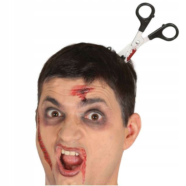 

czarny humor Nożyczki wbite w głowę na Halloween