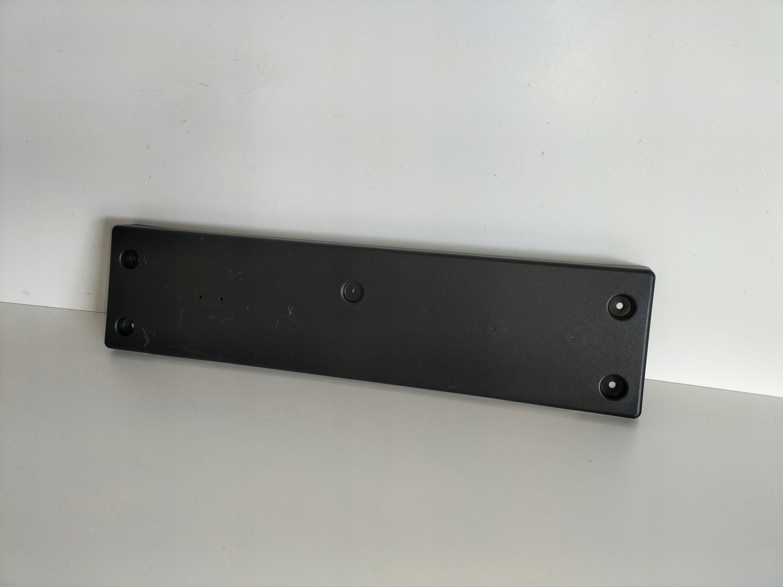 pad below tablice registration front KIA SPORTAGE 5 V LIFT 25