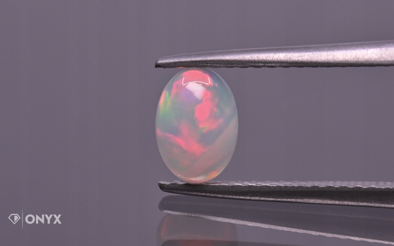Opál z Etiopie kabošon ovál 7x5 mm