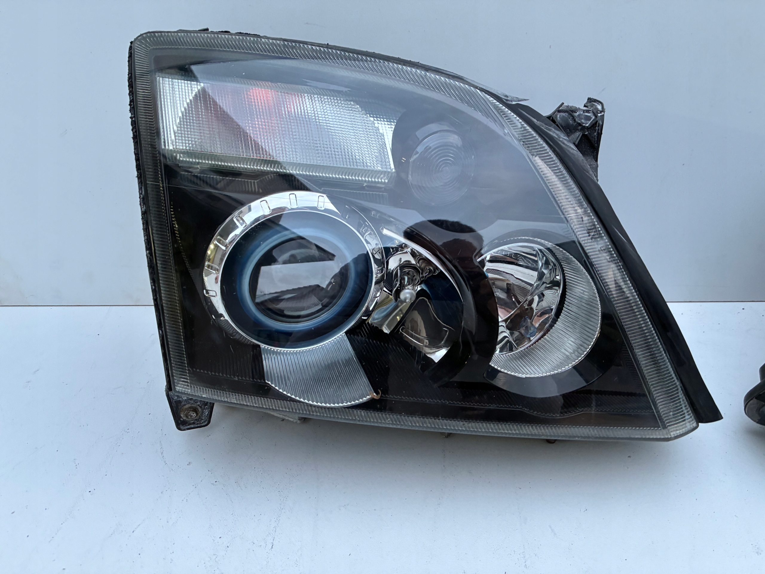 Reflektor light right left front Xenon positioning Opel VECTRA C 02-05r. OEM EU