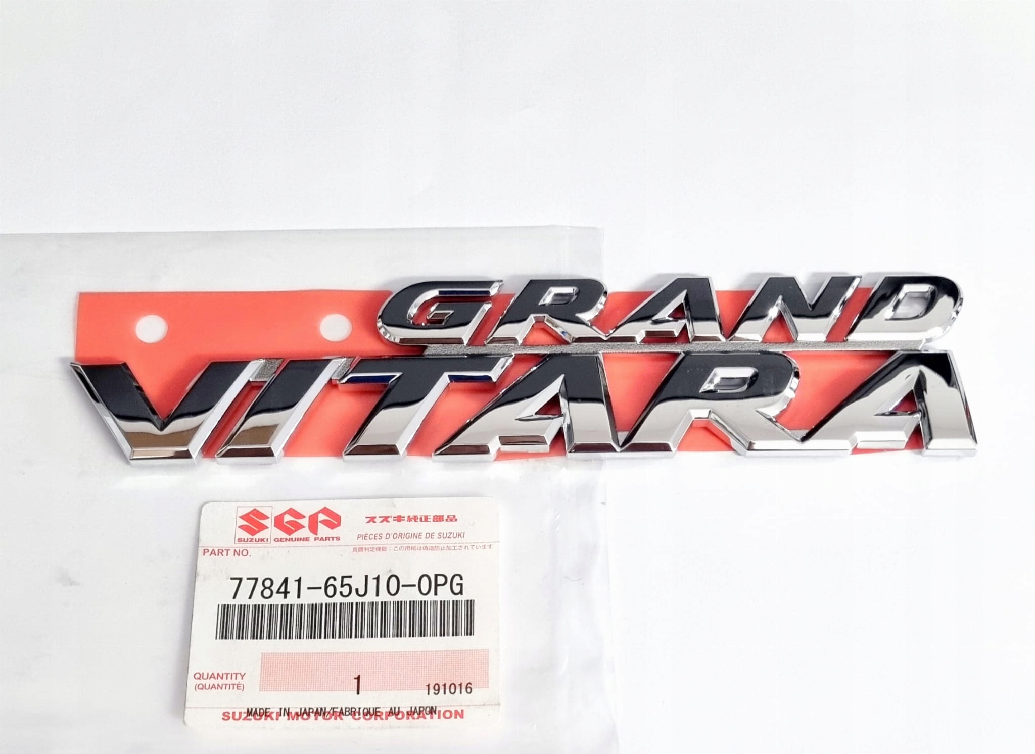 

Emblemat logo napis Grand Vitara 77841-65J10-0PG
