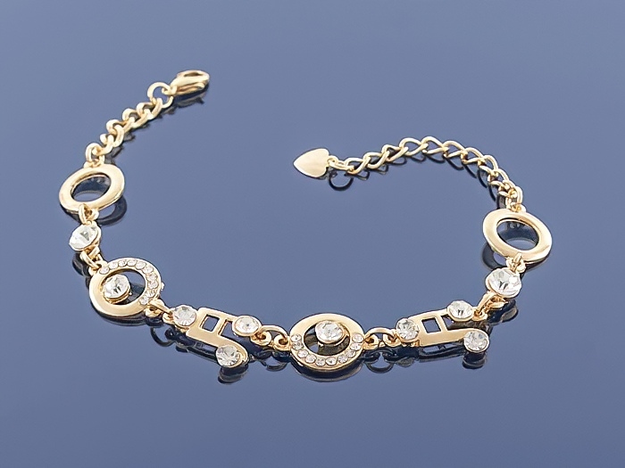 

Złota bransoletka Charms