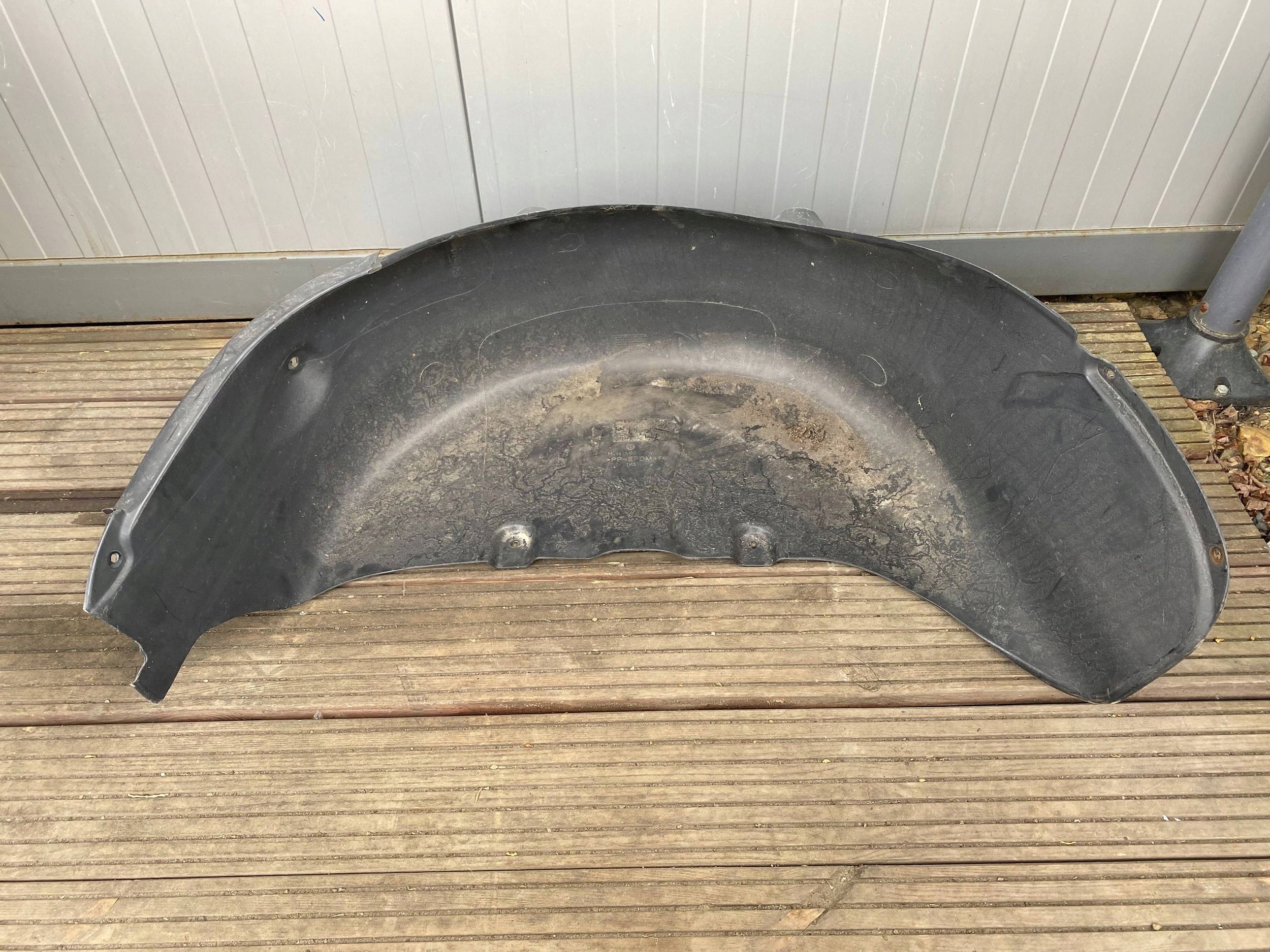 VW CADDY III 15- mudguard left rear part rear. 2K0810971E