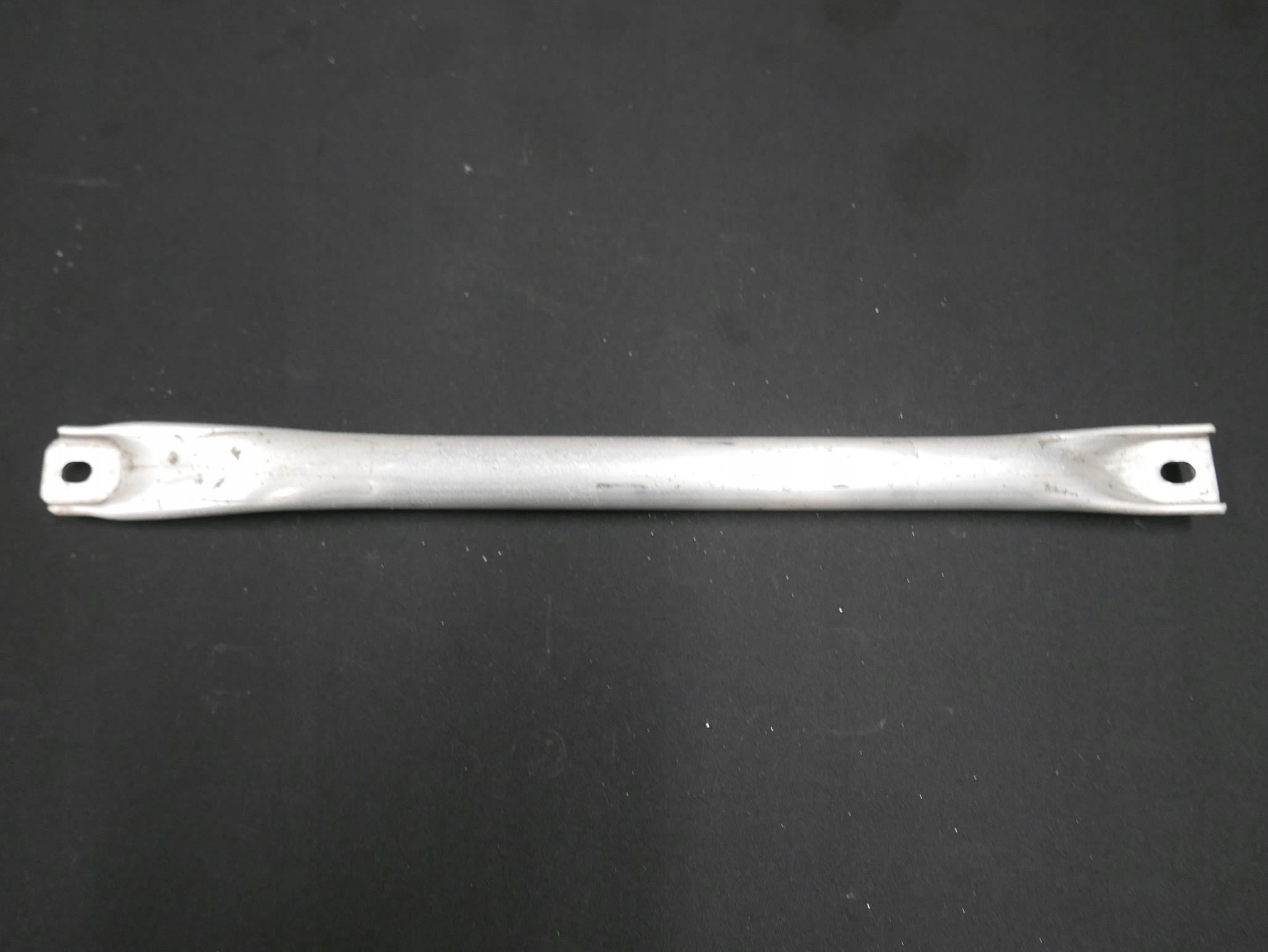 BMW F10 F11 POPRZECZKA ROZPÓRKA LEWA TYLNA 7180315