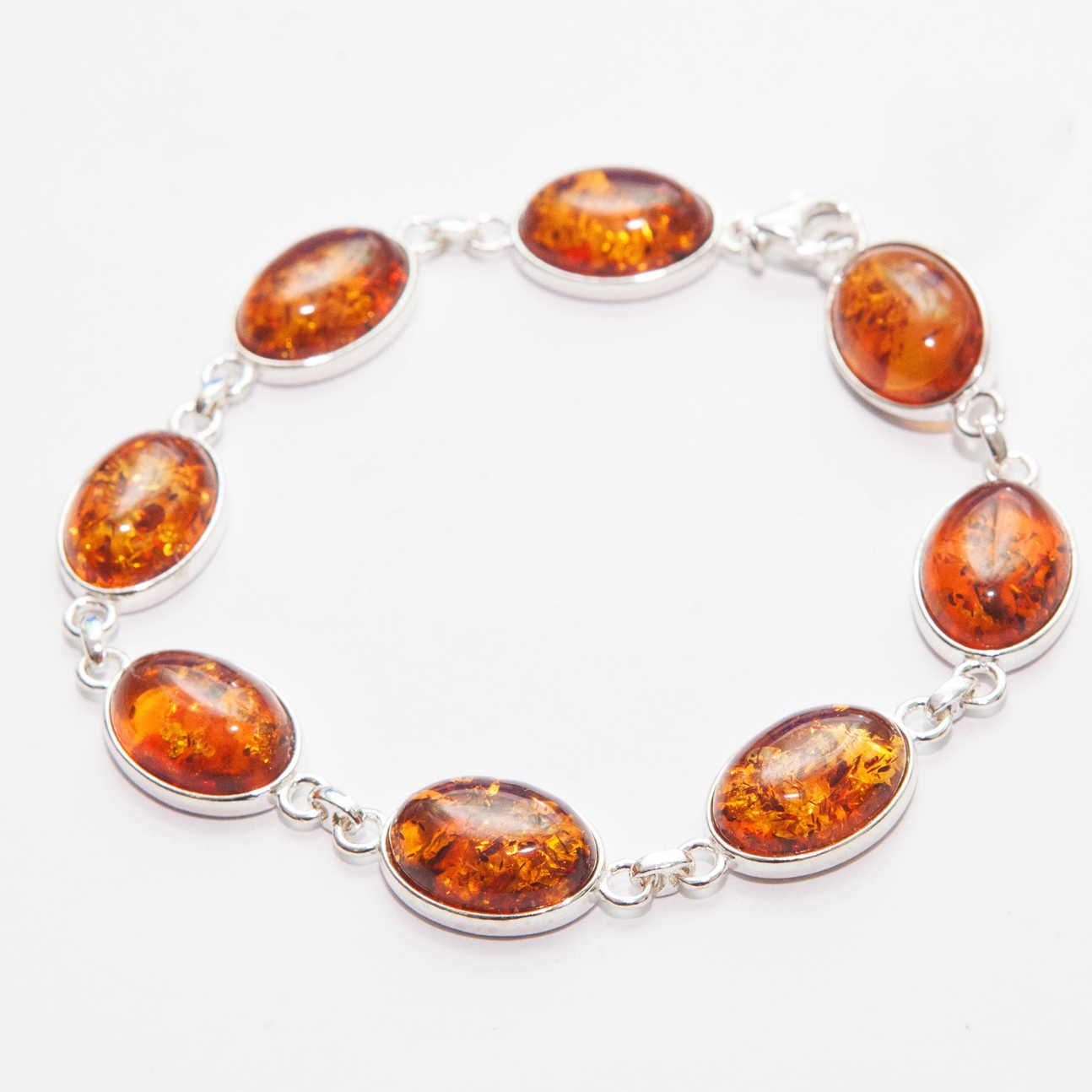Stříbrný náramek s jantarem stříbro 925 oválná očka velká koňaková