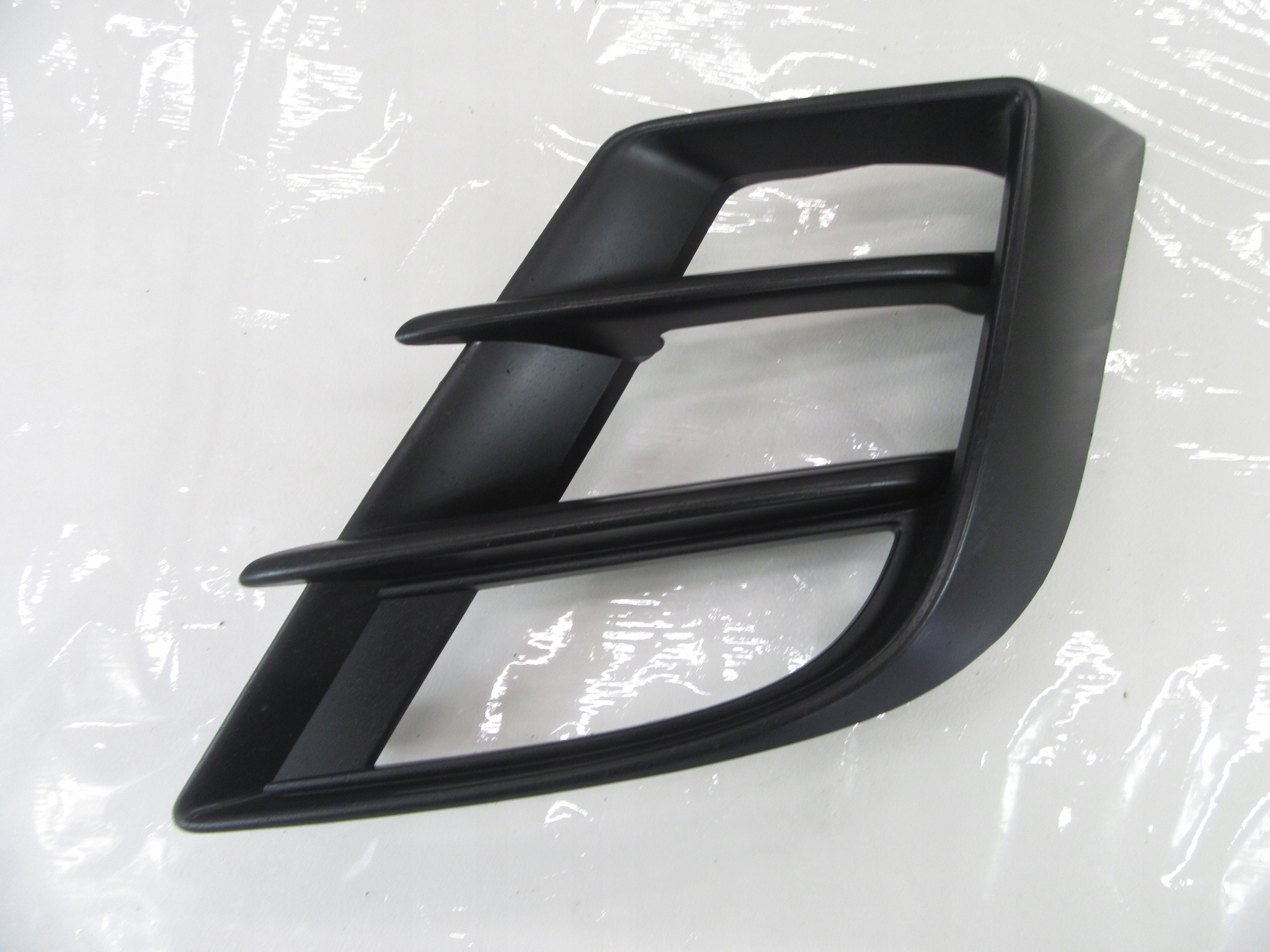 grid of a bumper cover spoiler Mazda 3 BL bbp8-50c21 LH