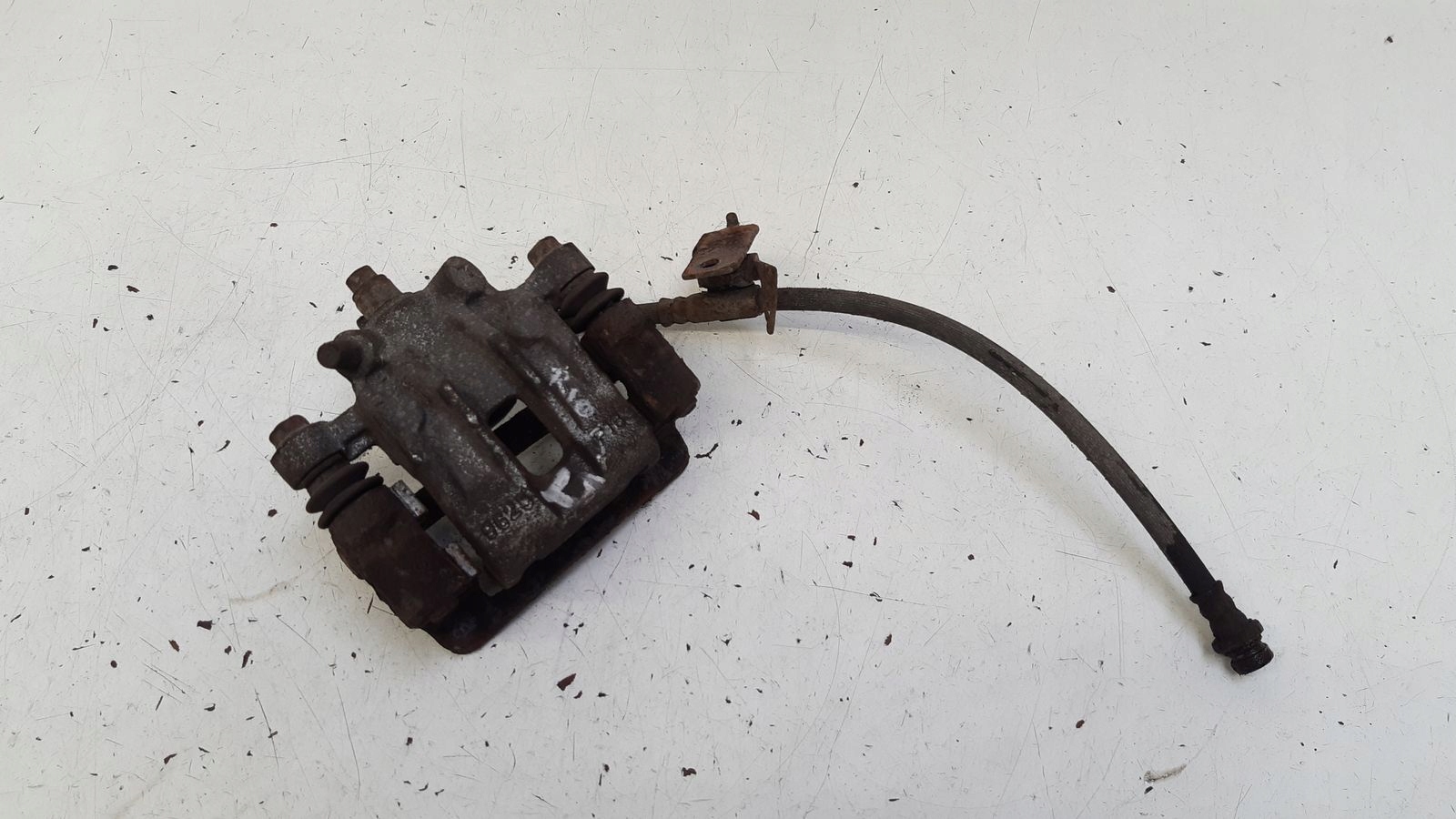 caliper rear part rear left Kia Rio II 1,4