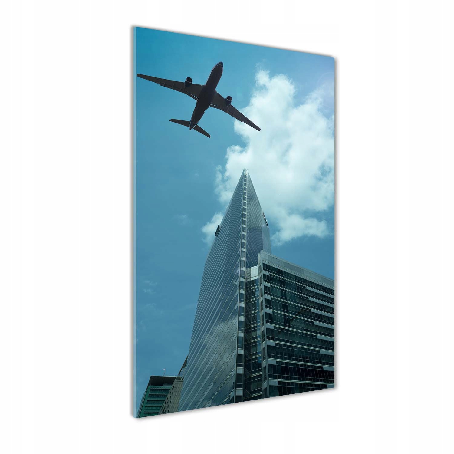 

Foto obraz akrylowy Samolot nad miastem 60x120cm