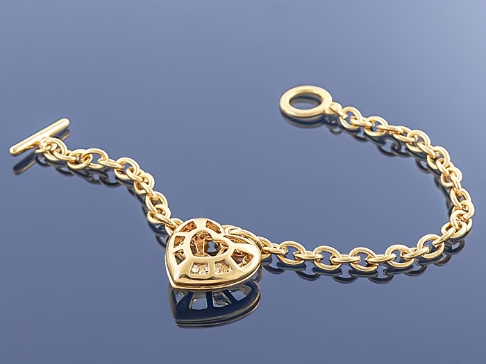 

Złota bransoletka Charms