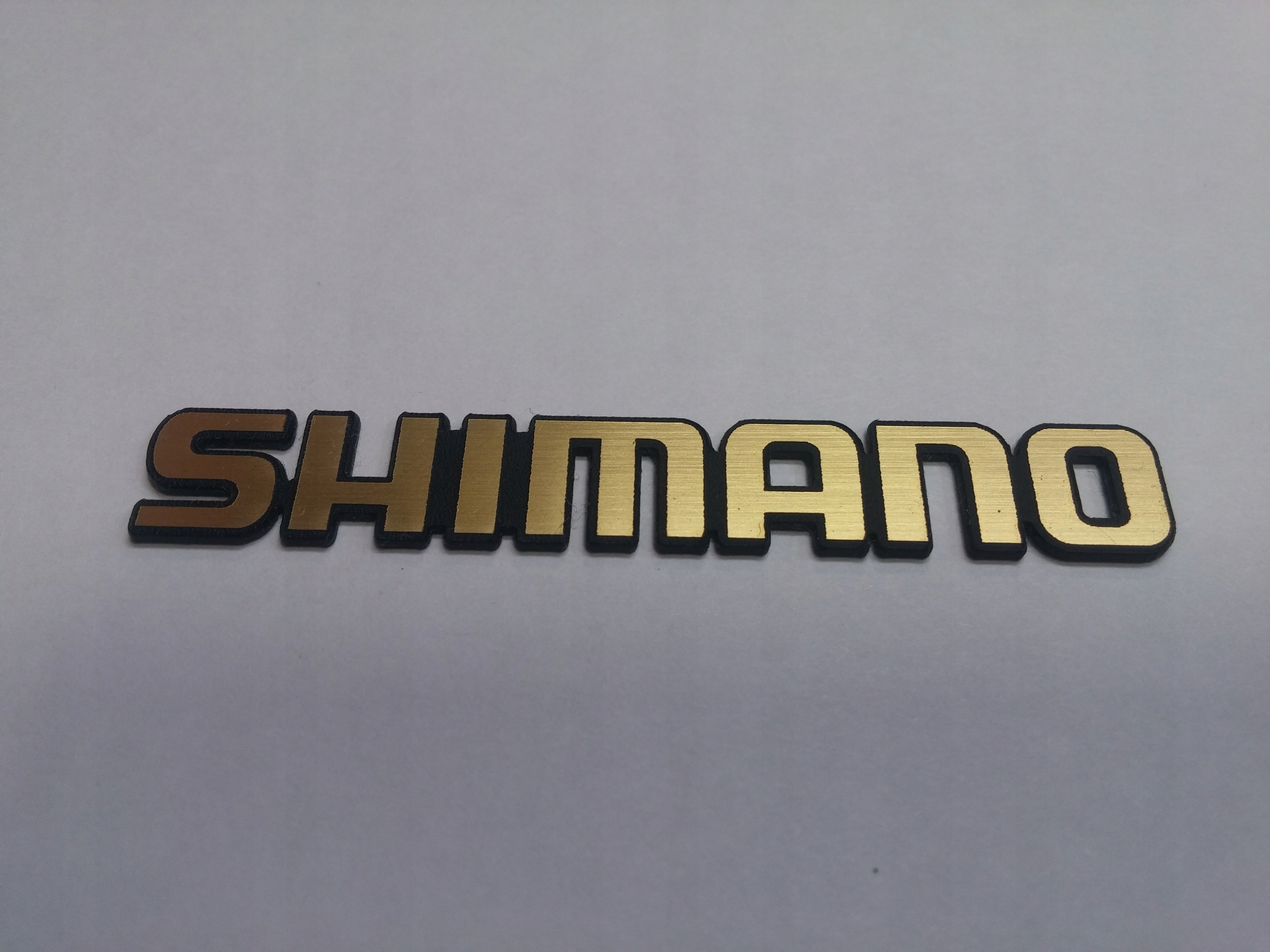 

Shimano naklejka emblemat 132 x 20 mm * Złota