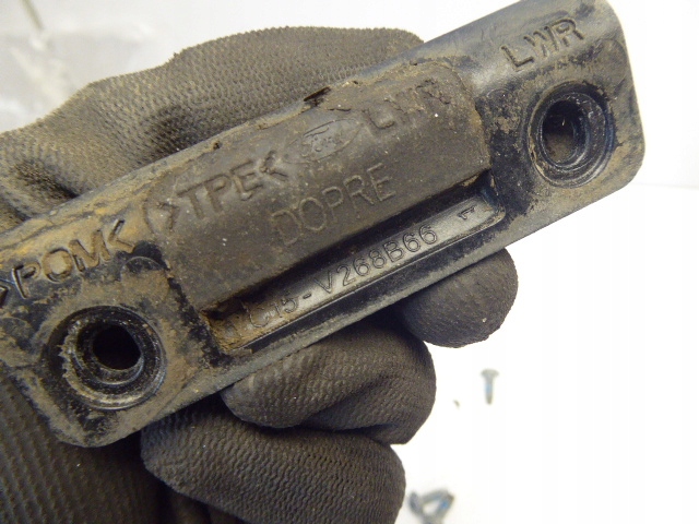 TRANSIT MK7 06-13R RYGIEL DRZWI PRZESUWNYCH LEWY Producent części Ford OE