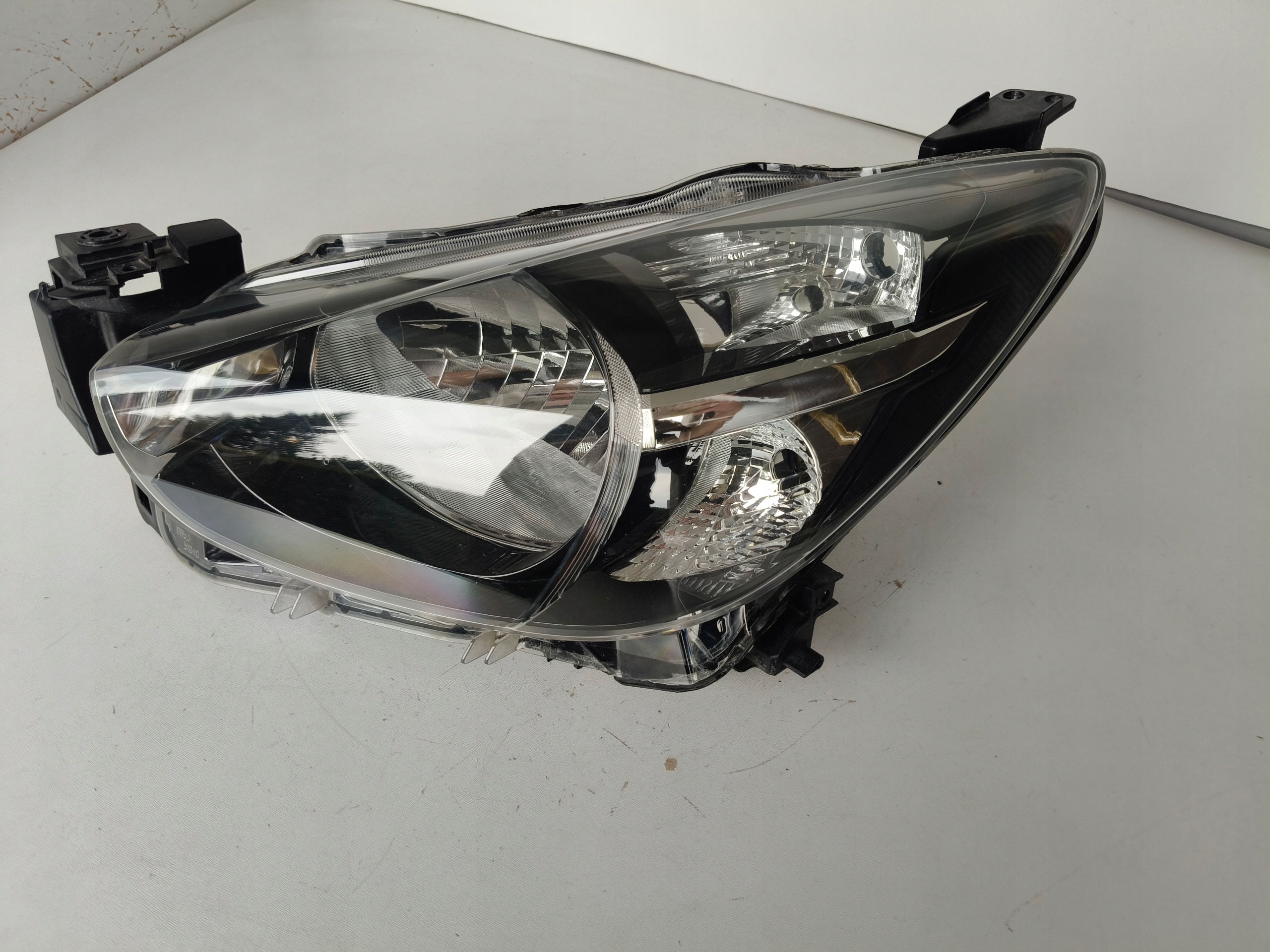 light left REFLEKTOR MAZDA 2 14