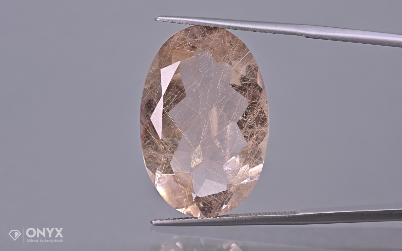 Křemen s rutilem fazetovaný ovál 26,5x17,5 mm