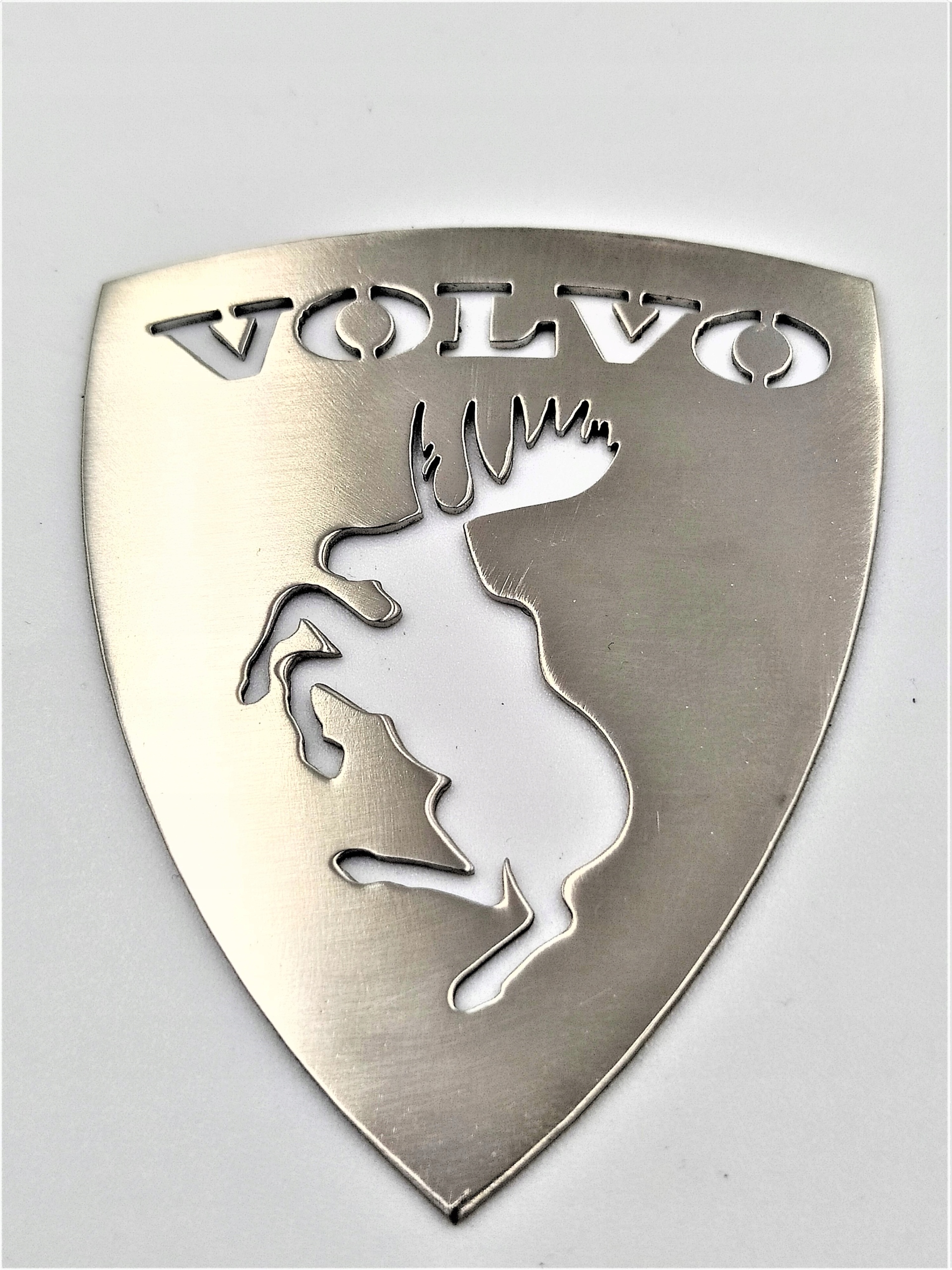 Вольво лось. Эмблема Лось Volvo. Значок Вольво с лосем. Герб Вольво. Шильдик Вольво Лось.