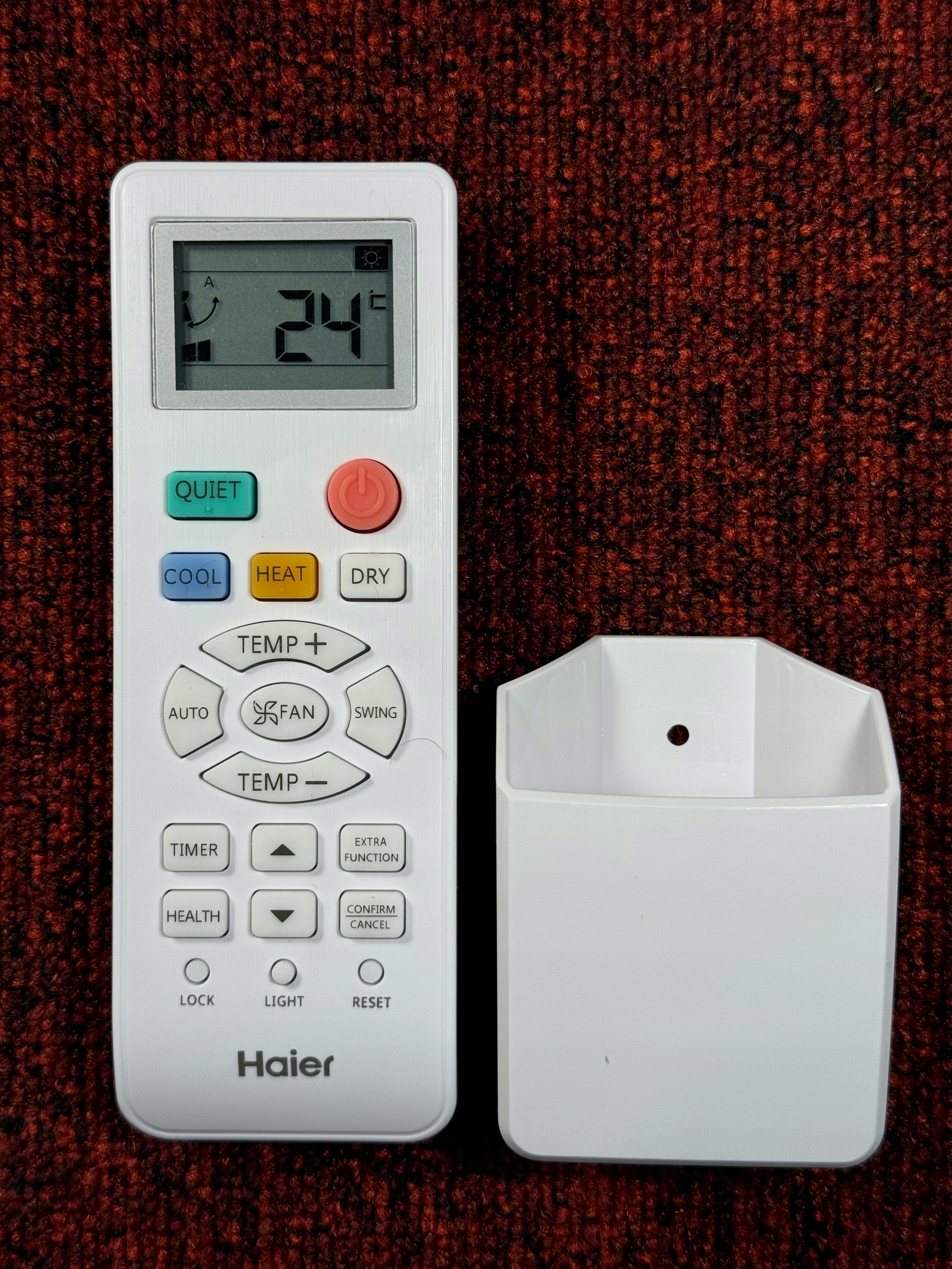 Pilot klimatyzacji Haier z uchwytem ściennym