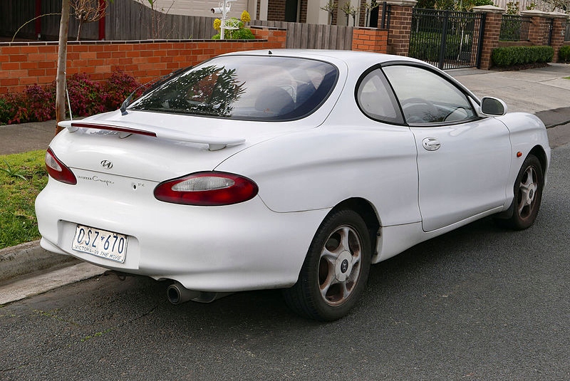 HYUNDAI COUPE 96-99 ZDERZAK TYLNY TYŁ Z BELKĄ
