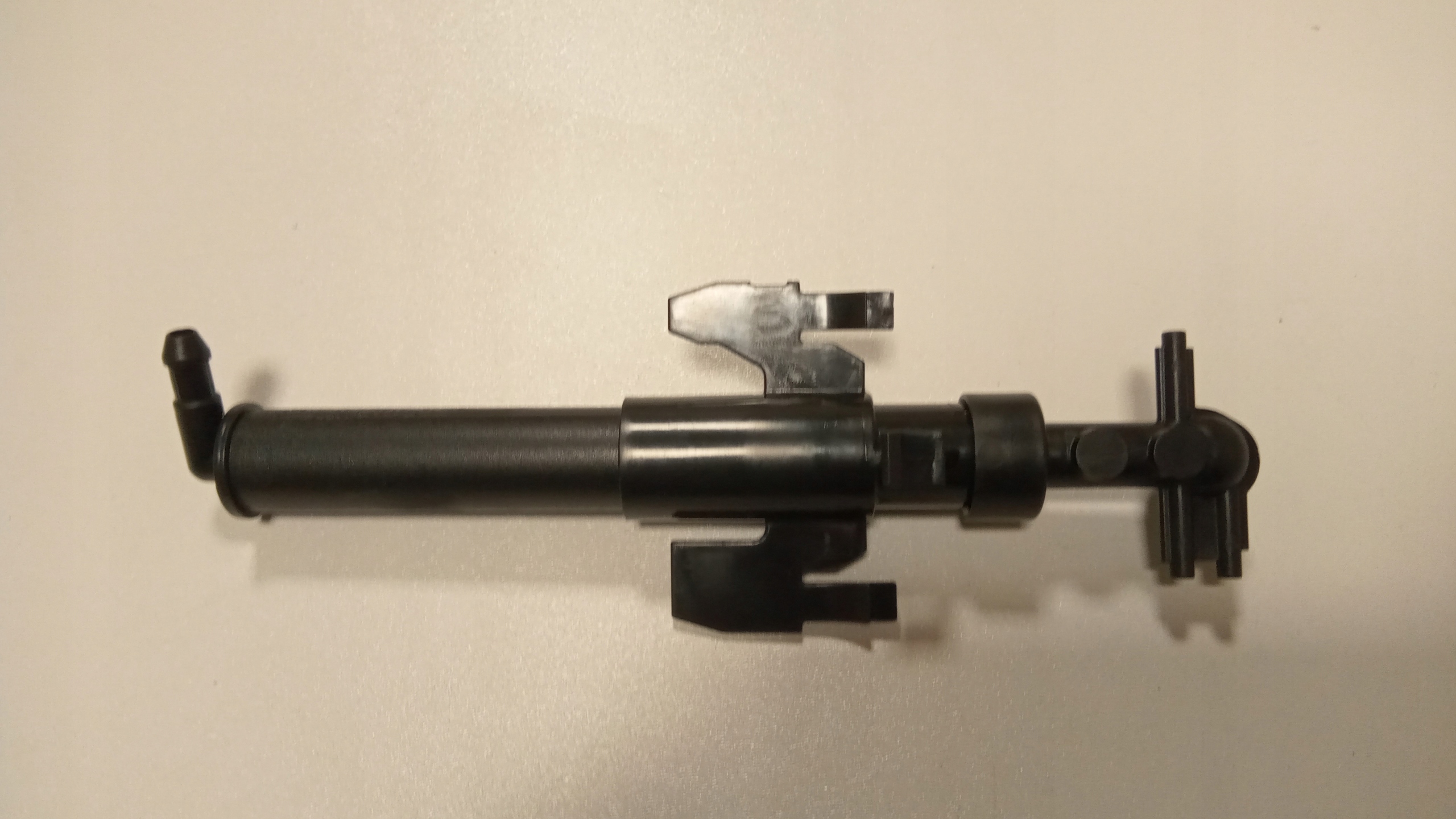 SPRYSKIWACZ LAMPY LEWY PRZÓD VOLVO XC40 Producent części Volvo OE