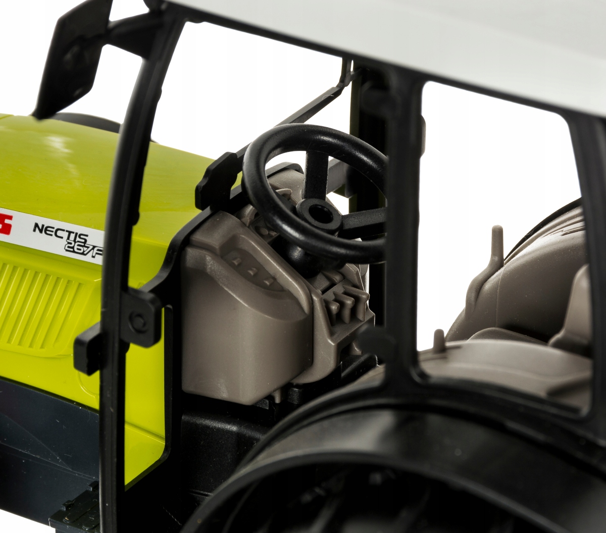 Traktor Class Nectis 267F + ramię koparki Bruder Materiał plastik