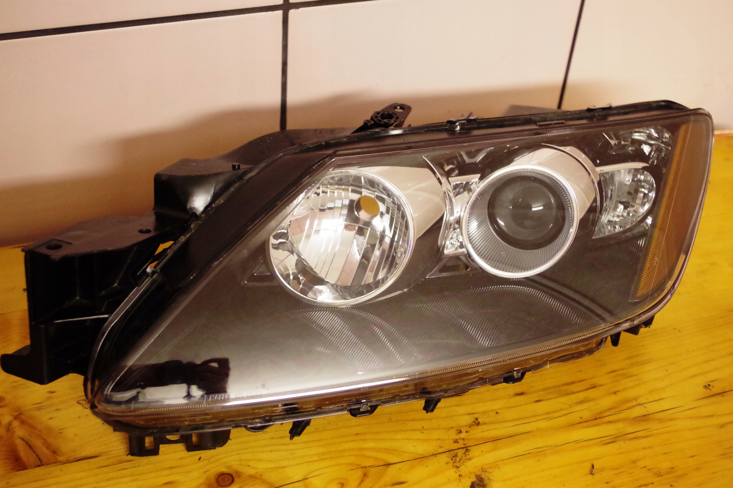 MAZDA CX-7 LAMPA LEWA SCHEINWERFER BEIFAHRERSEITE 10041027 EH1151040