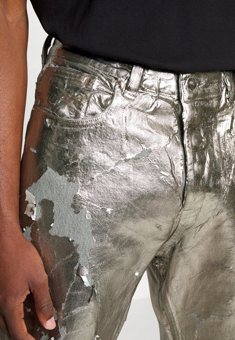 Stříbrné džíny s velkými oděrkami Diesel 40/32