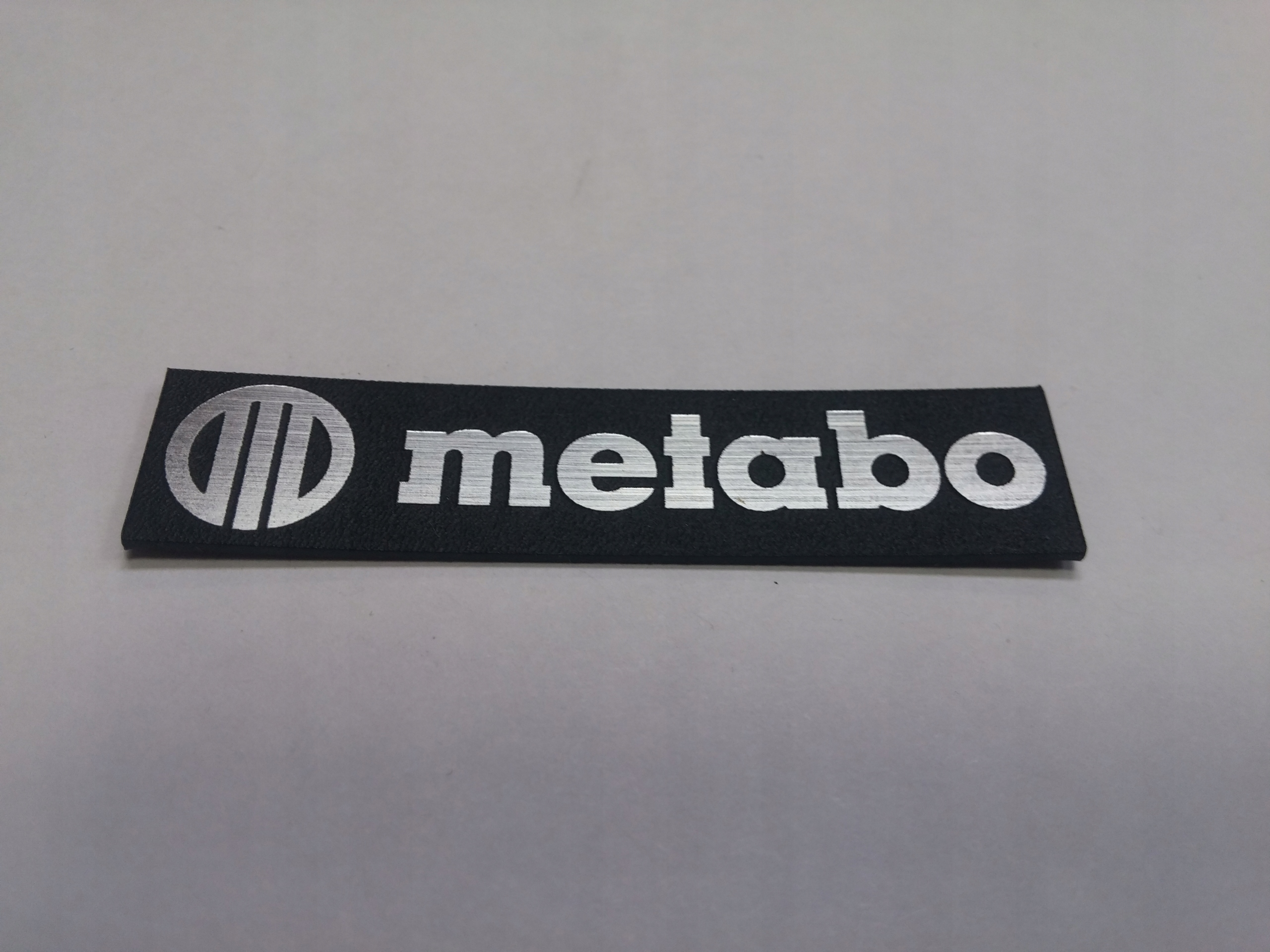 

Metabo naklejka emblemat 56 x 13 mm * Srebrna