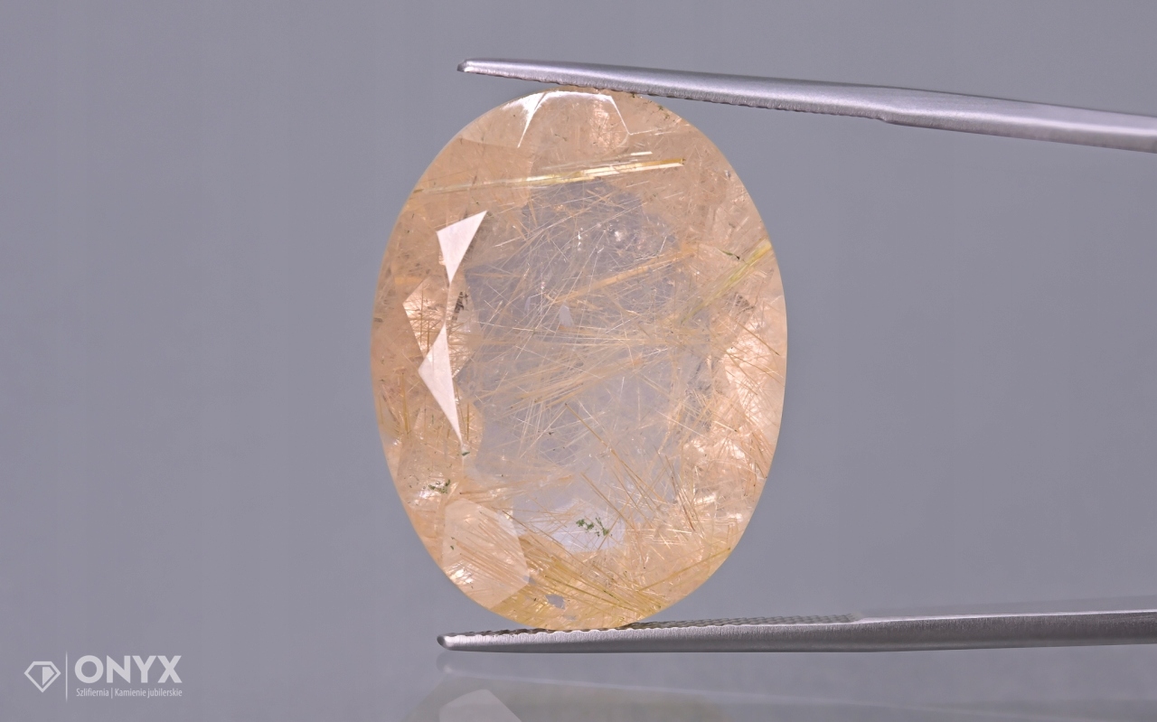 Křemen s rutilem fazetovaný ovál 26x20 mm